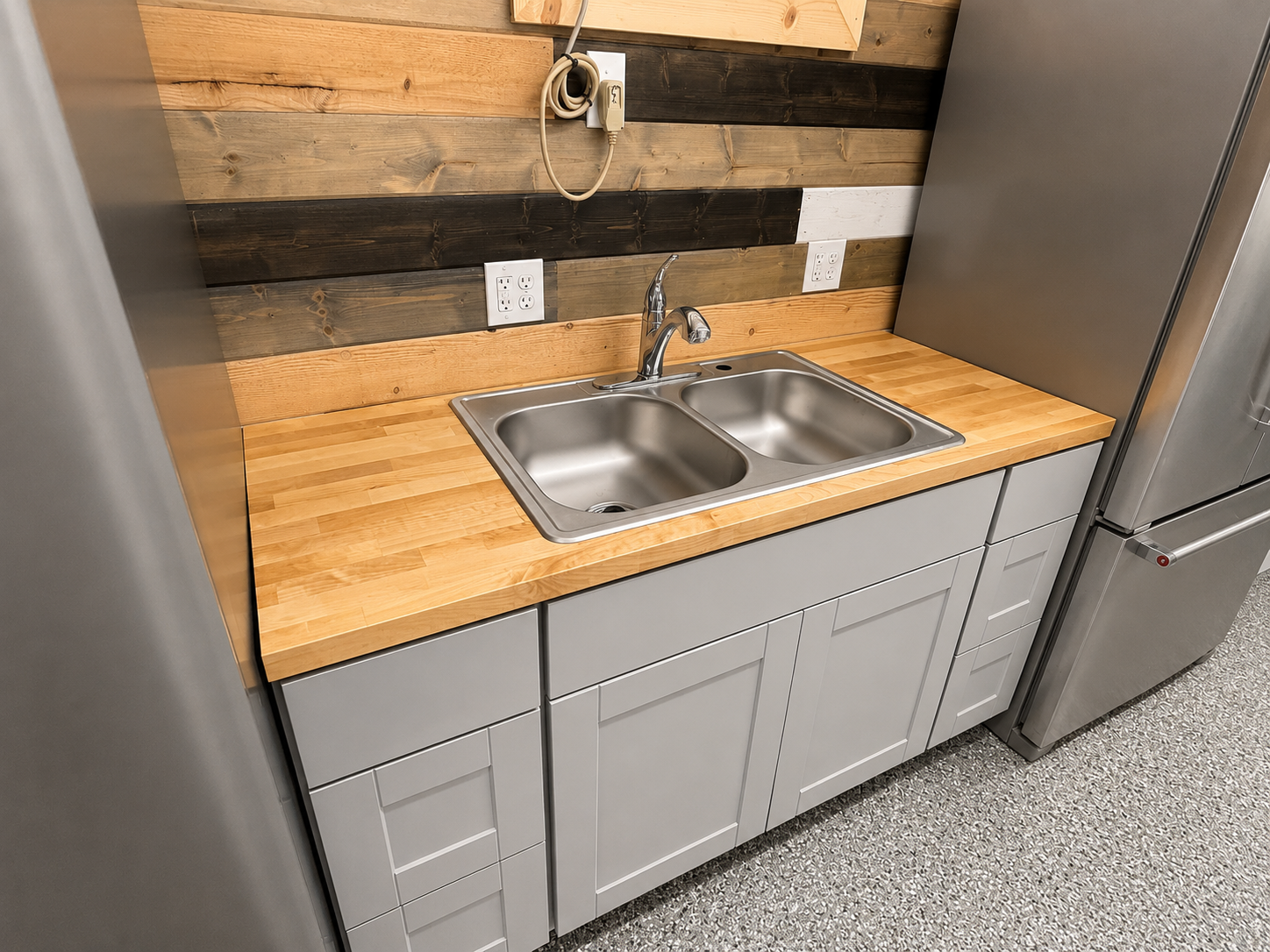 Shipping container snack bar build out, with base cabinets, butcher block countertops, and custom tongue and grove accent wall.