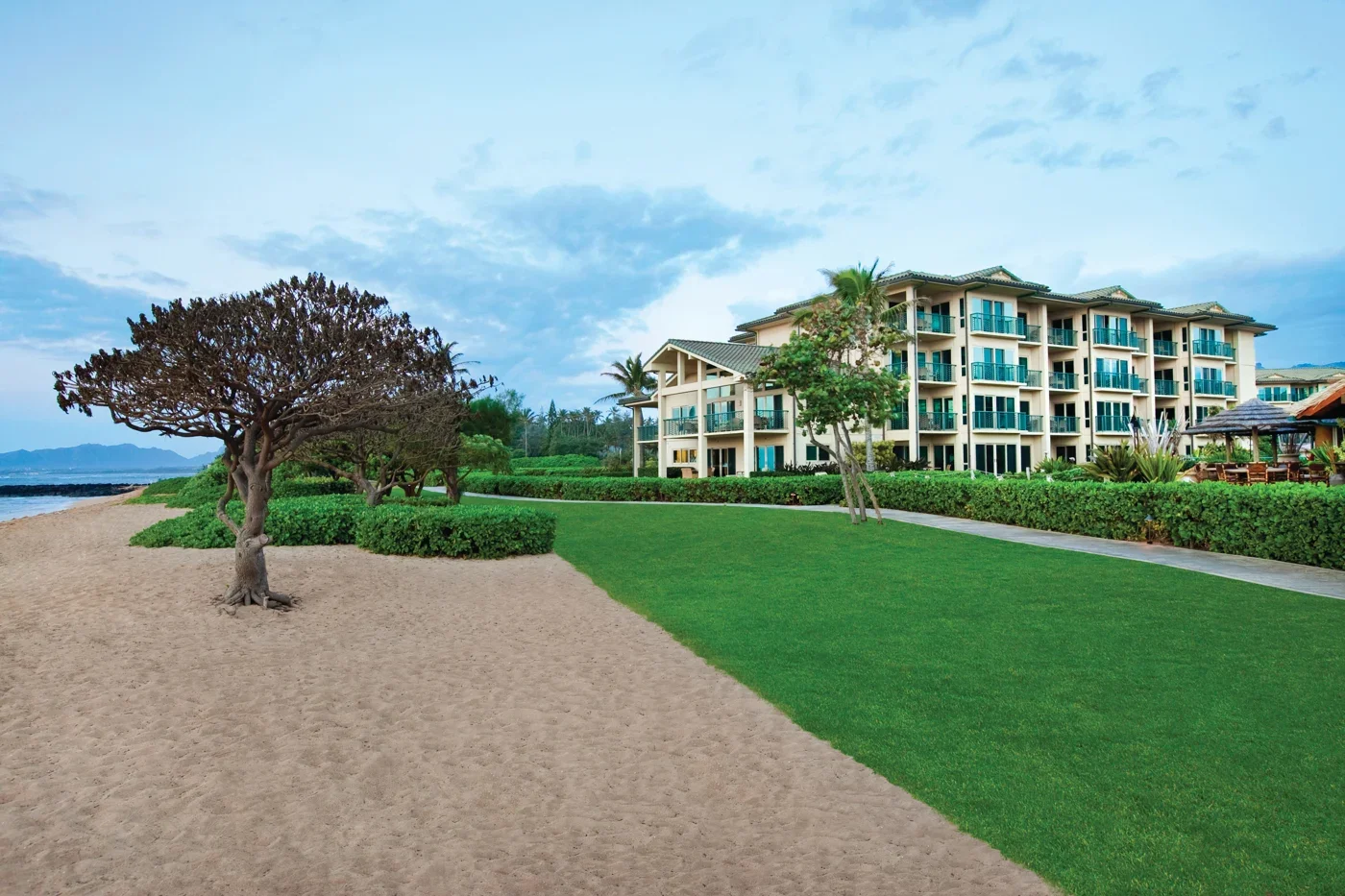 waipouli-beach-resort-kauai-exterior-beach.webp