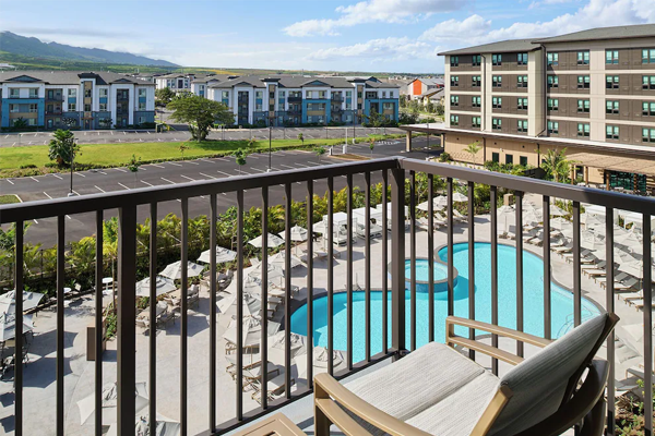 view of pool and ho'opili community from guestroom balcony