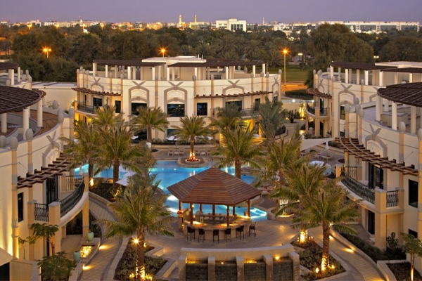 view of courtyard, pool and exterior of al ain rotana