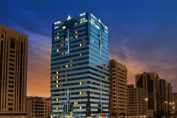 exterior view of al maha arjaan by rotana at sunset