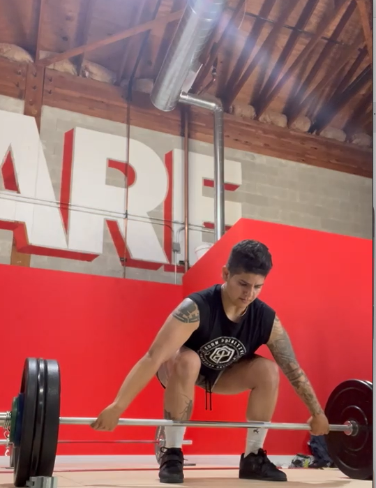 The Science Behind Powerlifting vs Olympic Lifting