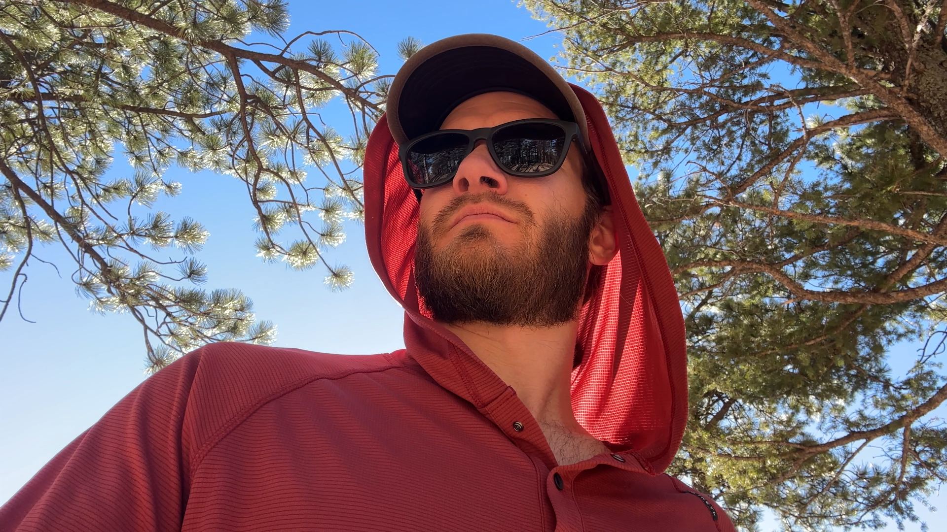 Ketl Mountain Nofry Sun Hoodie with the hood showing a face in the sun