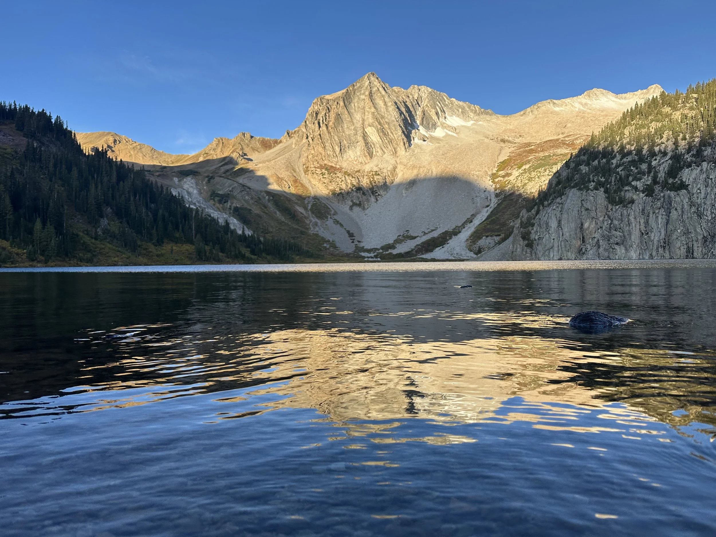 Beautiful Snowmass Lake with morning sunrise light in the apline