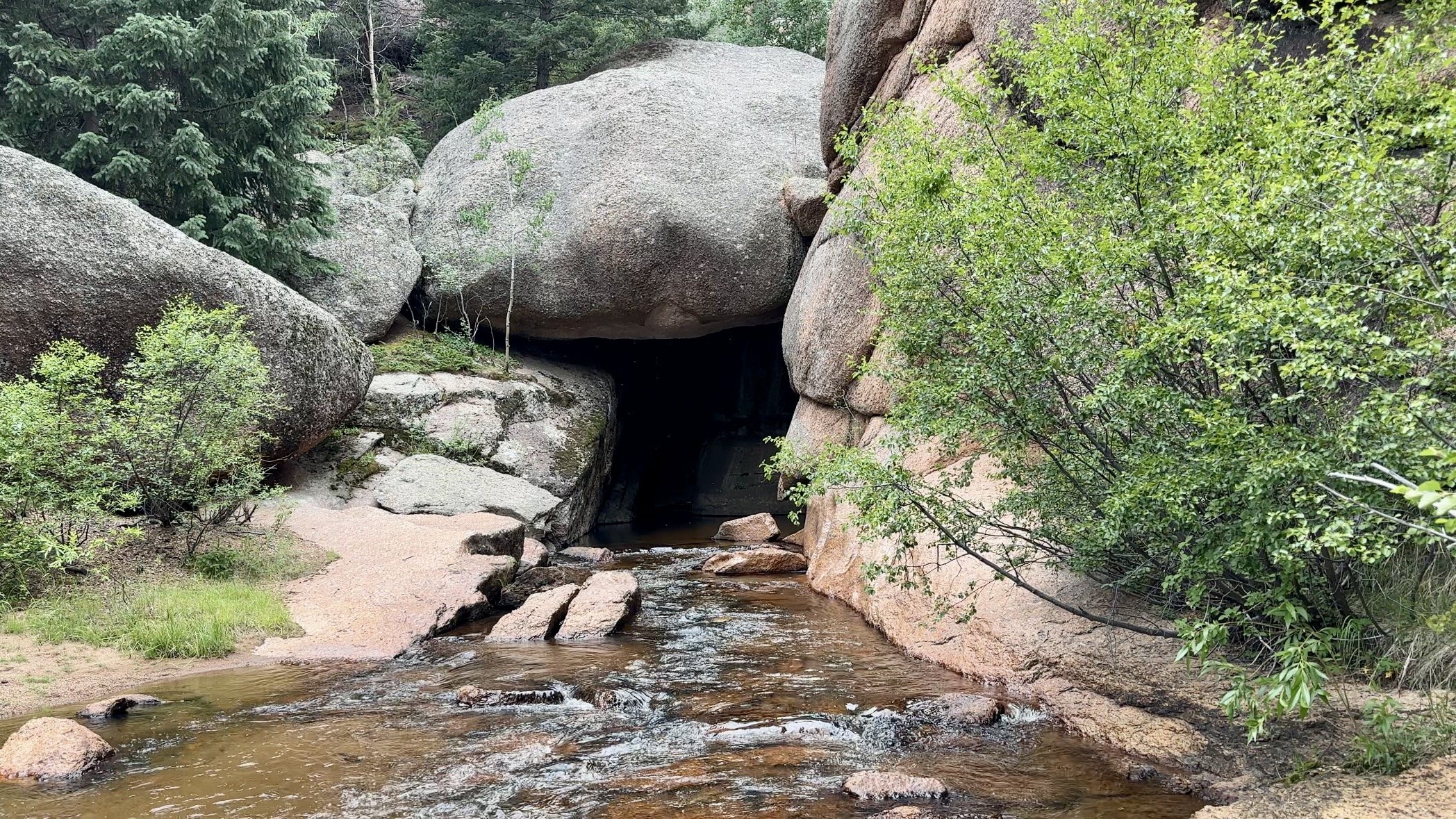 Entrance to a hidden cave filled with water