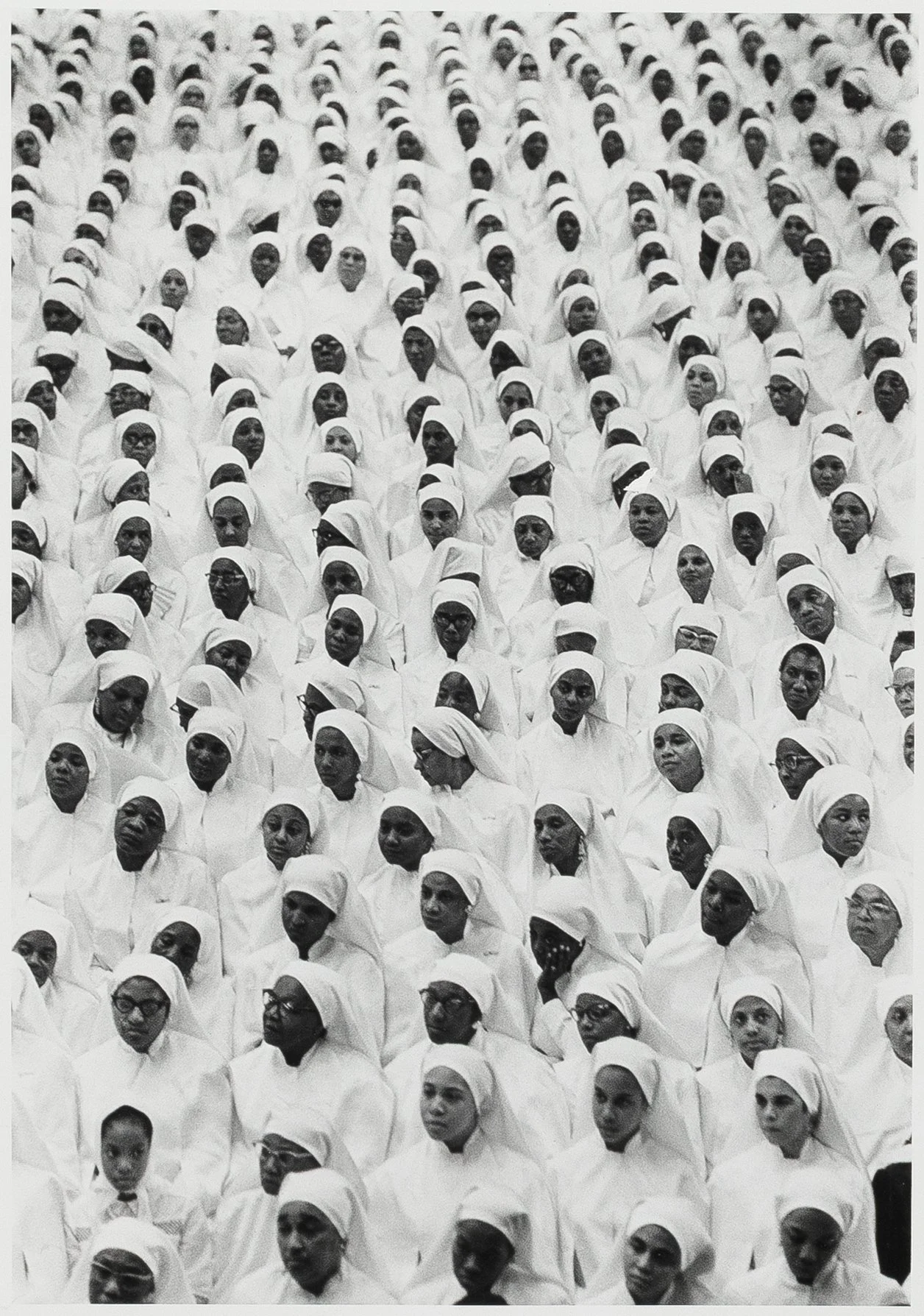 Savior's Day, 1966, printed 1988; gelatin silver print, 14 x 11 inches (sheet), signed and dated; stamped (Amalgamated Publishers).
Female Nation of Islam attendees during Saviour's Day celebrations at the International Ampitheatre, Chicago, Illinoi