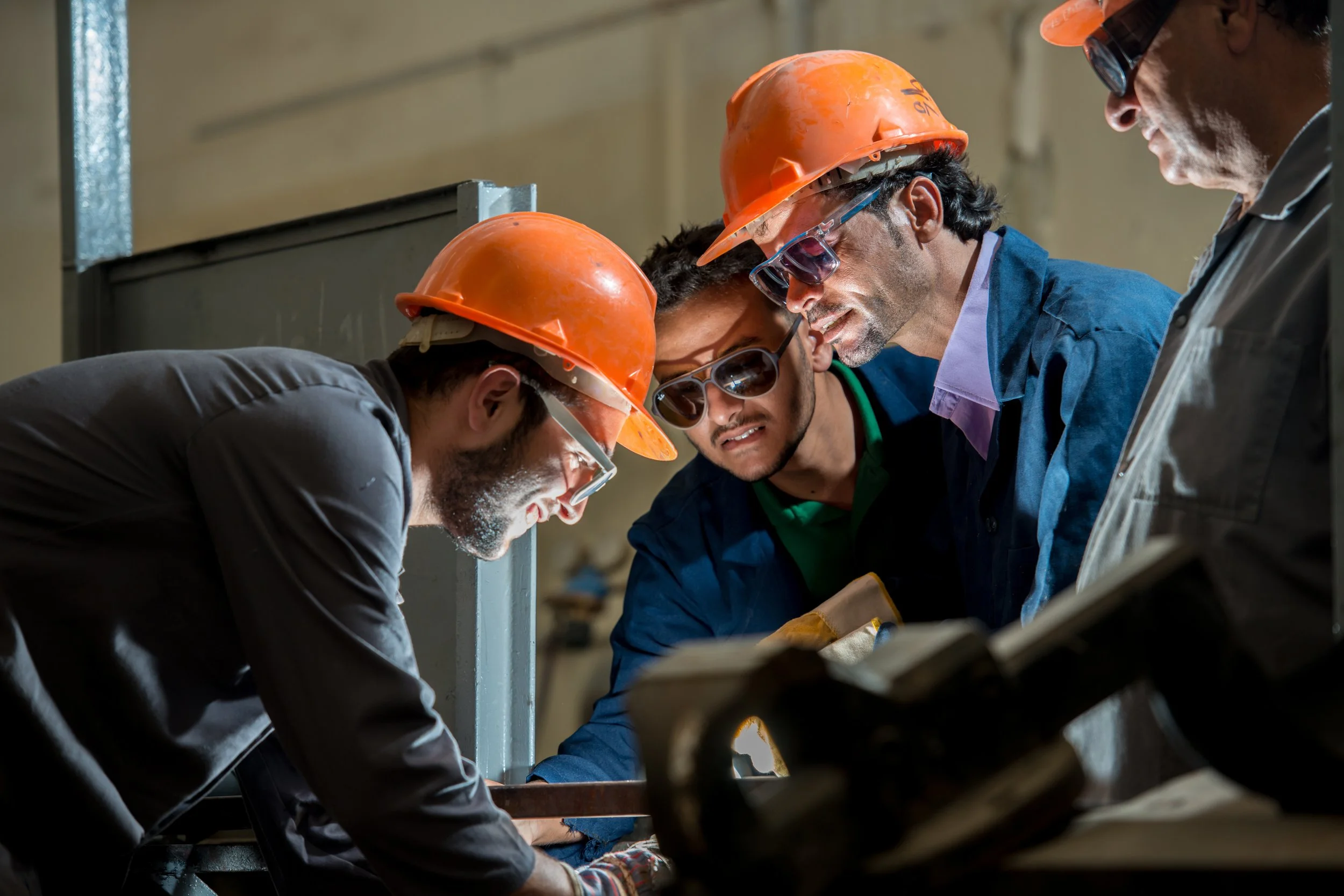 workers-in-industrial-factory-welding-SBI-300934515.jpg