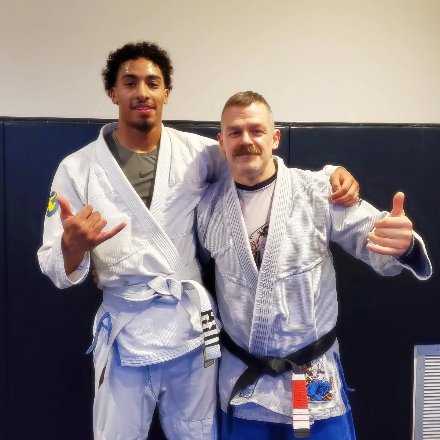 Bryson got his 4th stripe! Next stop blue. #brazilianjiujitsu #bigbiceps #tallmfers