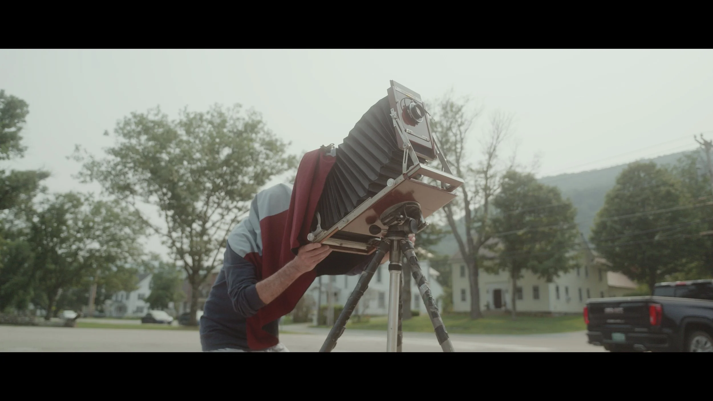 Photographer Jim Dow making a photograph with his large format 8x10 camera in Rochester, Vermont.