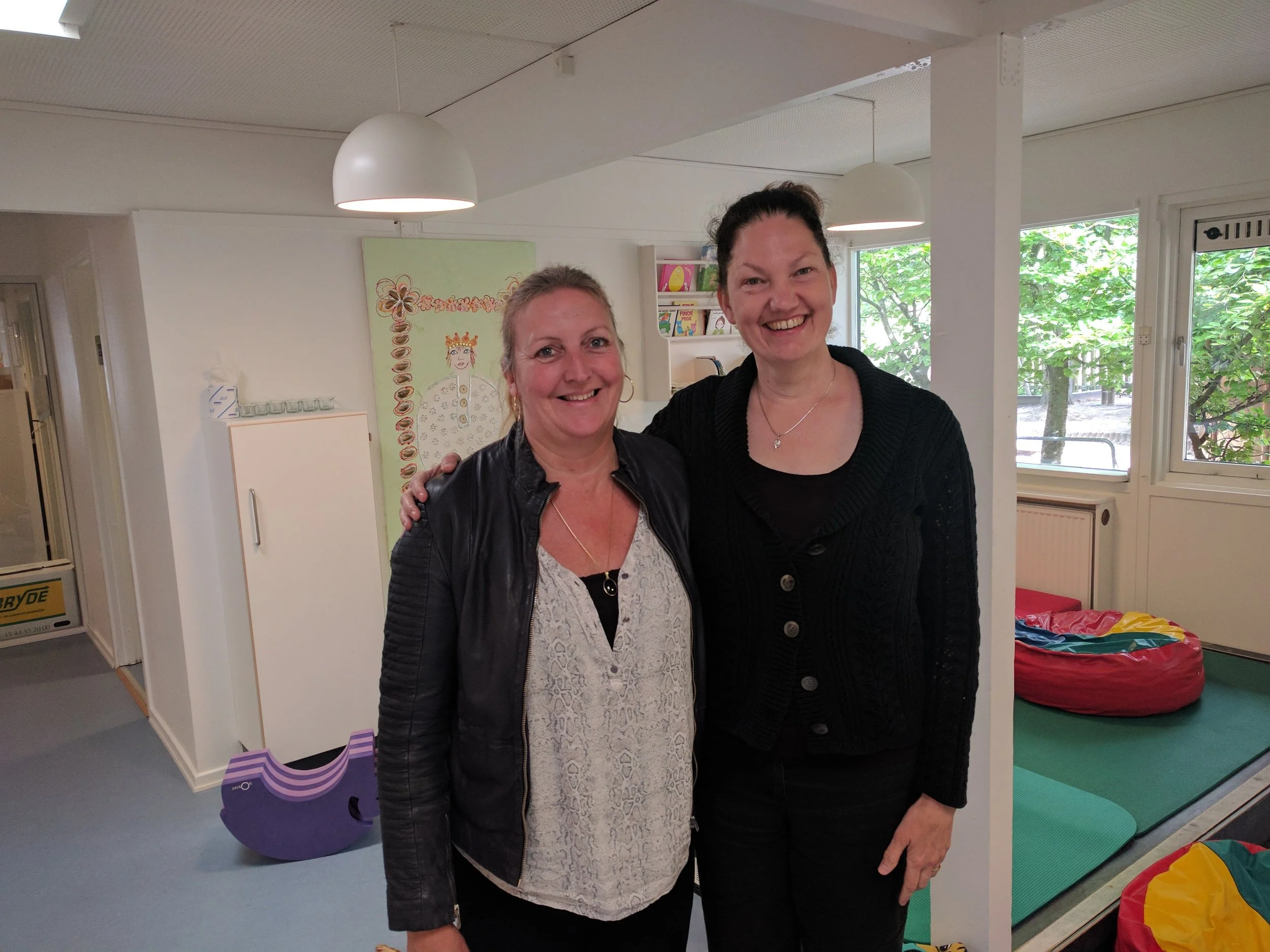 Kate MacCrimmon smiling with Danish childcare provider.