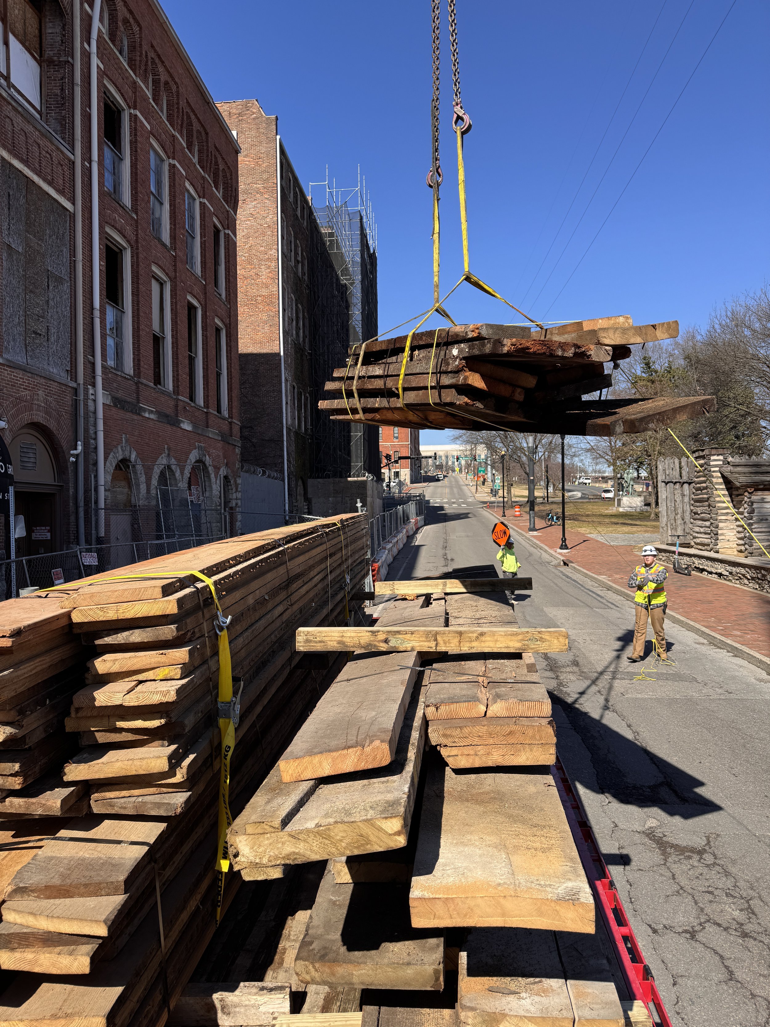 Wood joists being loaded onto our trailer by a crane!