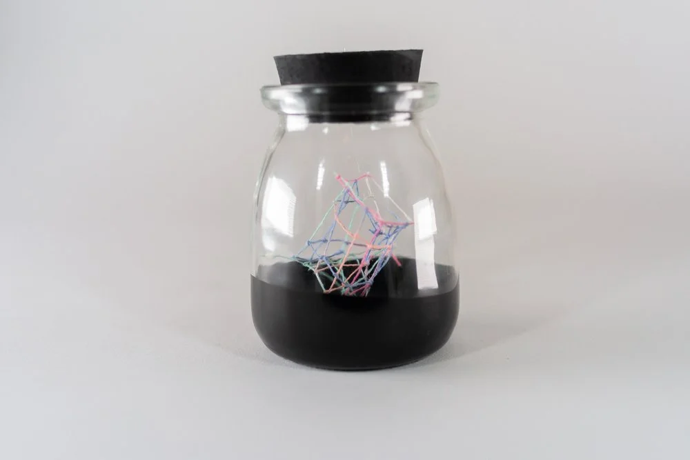 Small Ideas 1 • Embroidery floss, paint, glass jar • 2 1/4 x 2 1/4 x 3 1/2 in • 2022