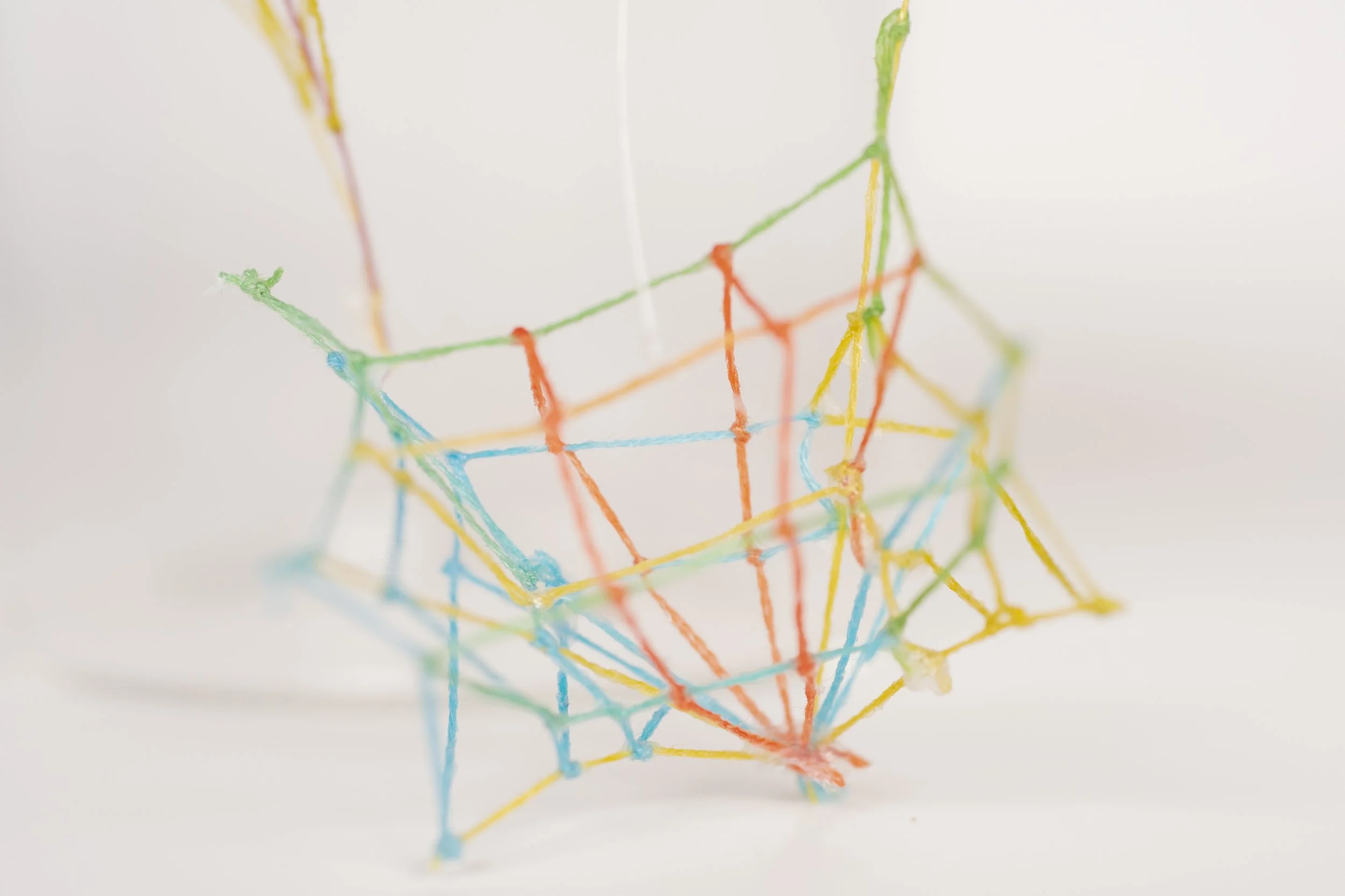 Specimen No. 3 • Embroidery floss, clear cord, corked glass jar • 5.5 x 4.5 x 6.5 in • 2021