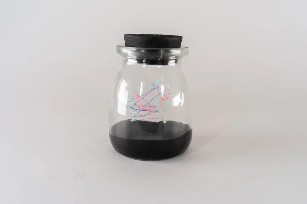 Small Ideas 10 • Embroidery floss, paint, glass jar • 2 1/4 x 2 1/4 x 3 1/2 in • 2022