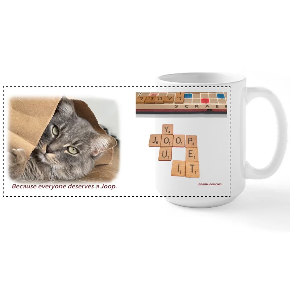 A black pet stroller with a cat inside, positioned next to a black chalkboard sign that reads "Summer menu" with banana, cream, and matcha ingredients listed, outdoors with trees and sunlight.