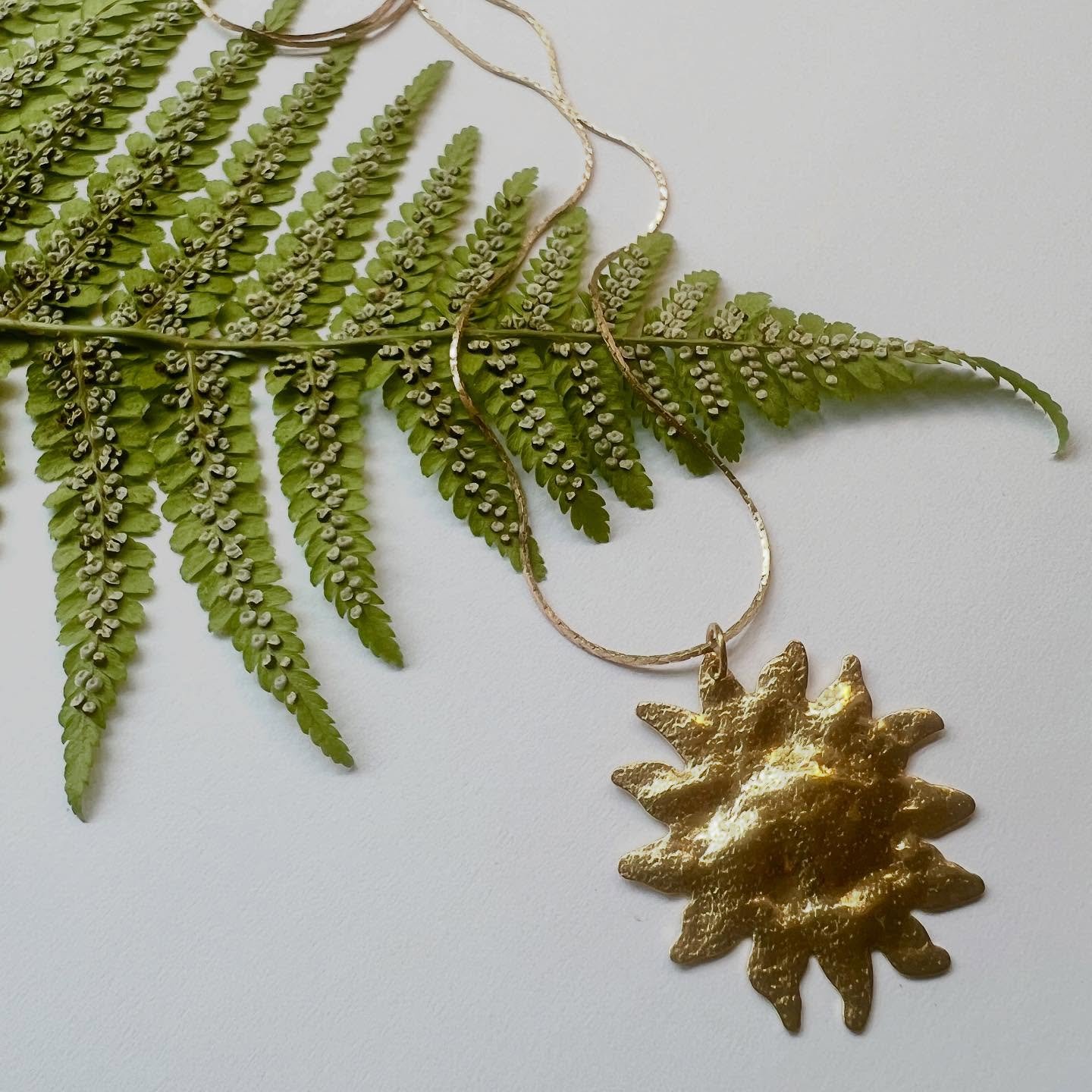 The SOL necklace has been super popular recently. ☀️ It looks beautiful when worn with a simple top in black or neutral tones. 
It&rsquo;s now available on my freshly updated website along with most of the rest of the product range. #bandofstarlings