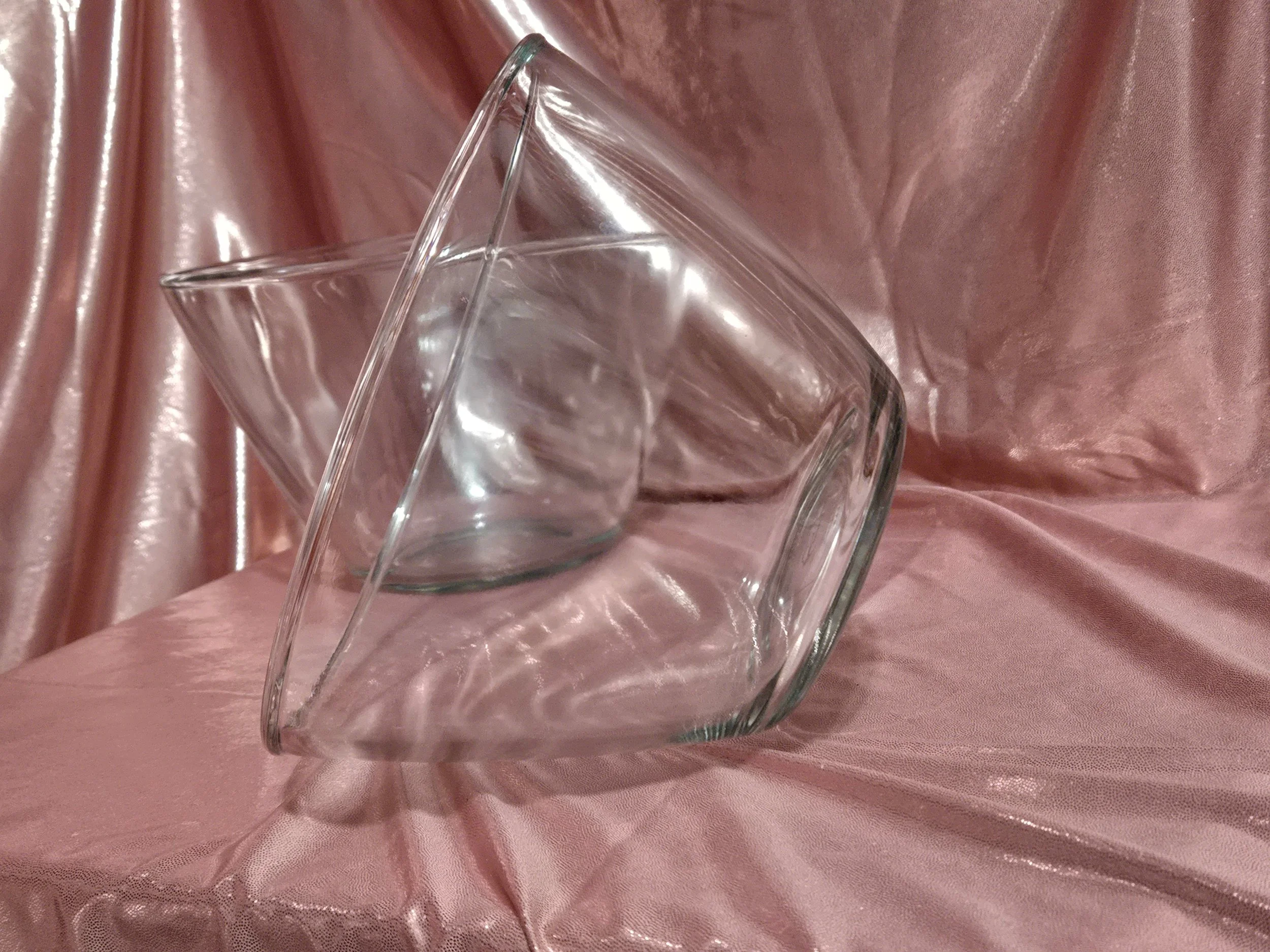 Side view of vintage clear glass Anchor Hocking mixing bowls highlighting curved shape and thick glass