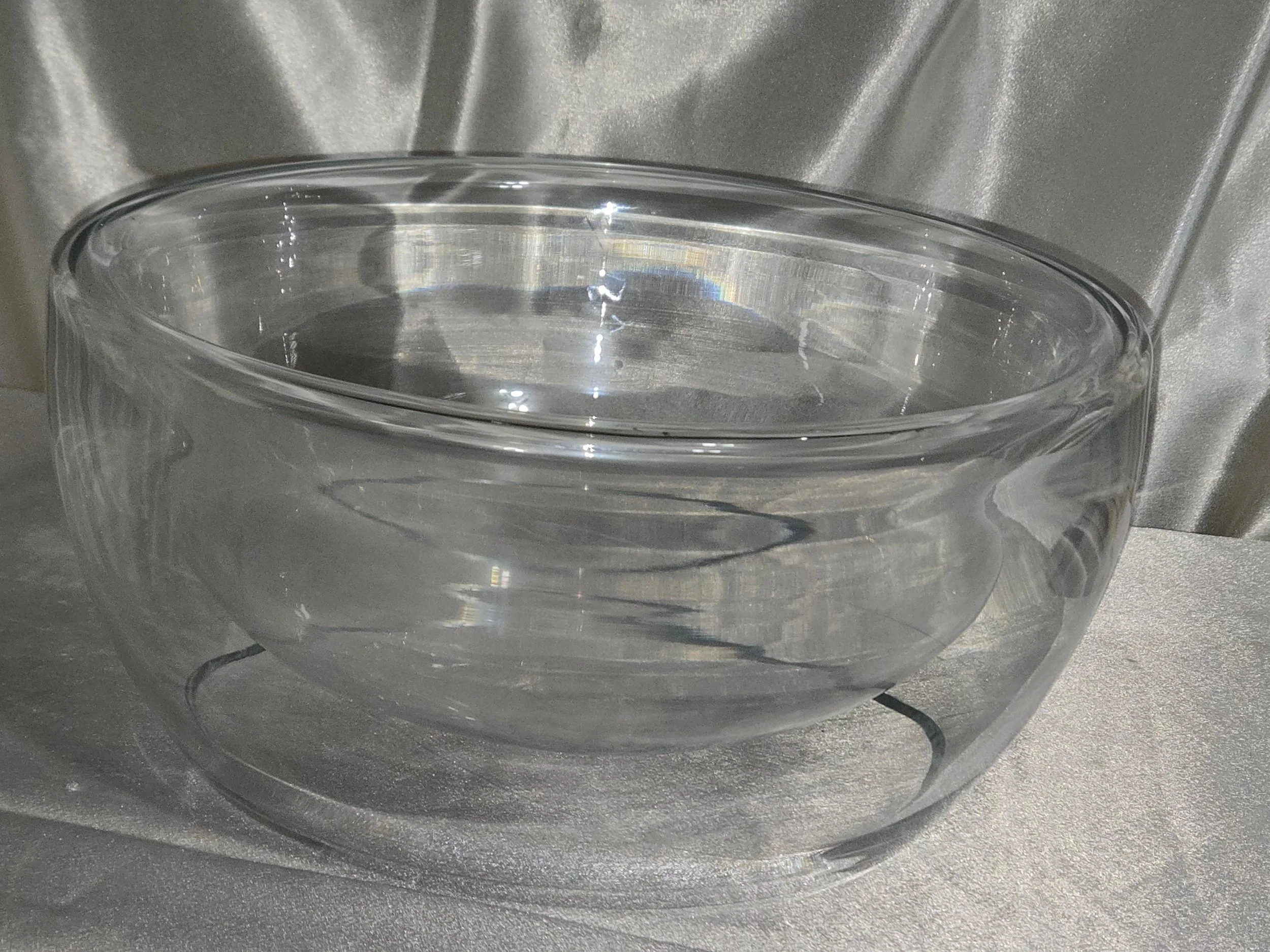 Clear glass sculptural bowl with thick layered glass construction
