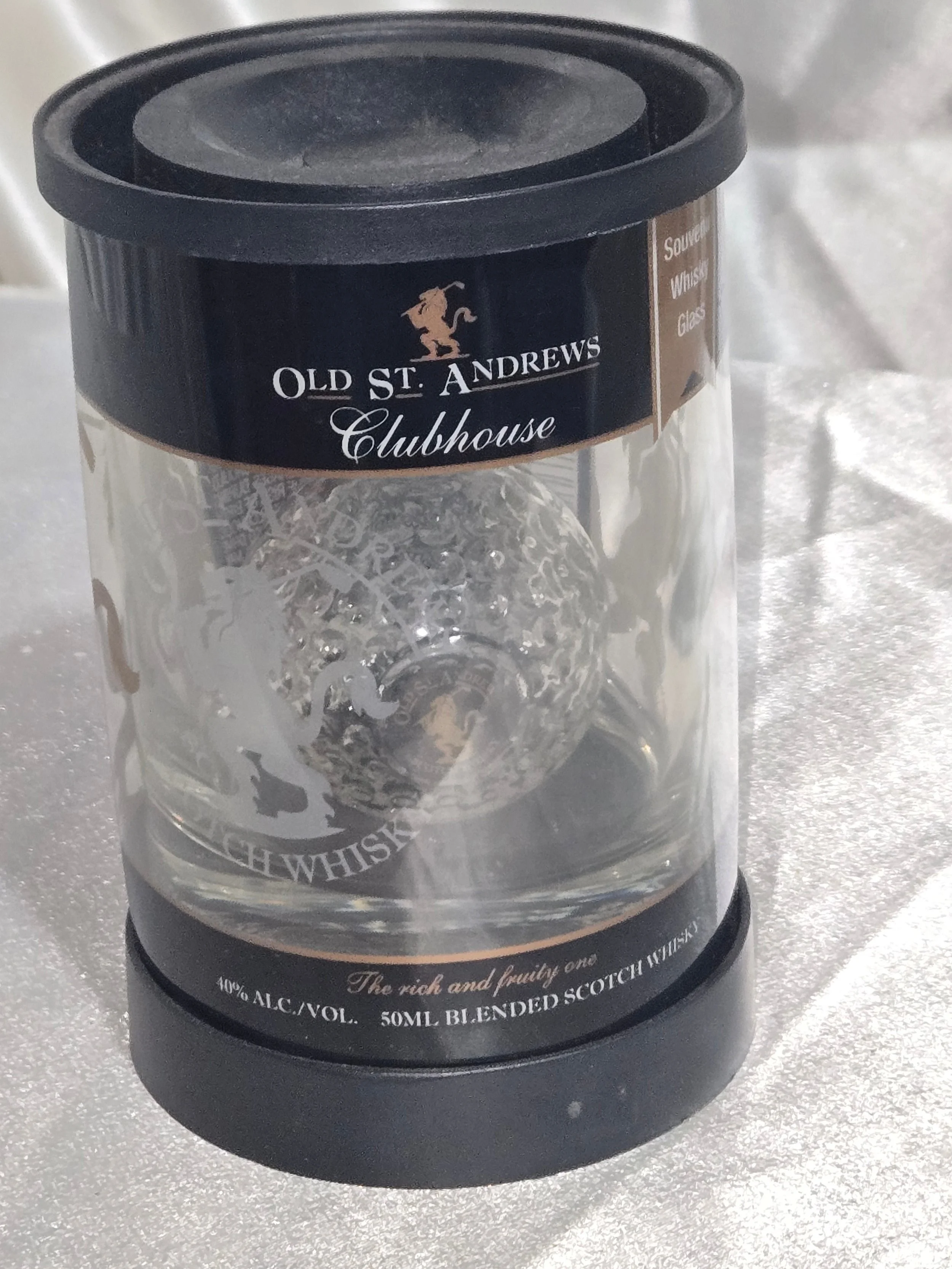 Close-up of branding and logo details on clear canister