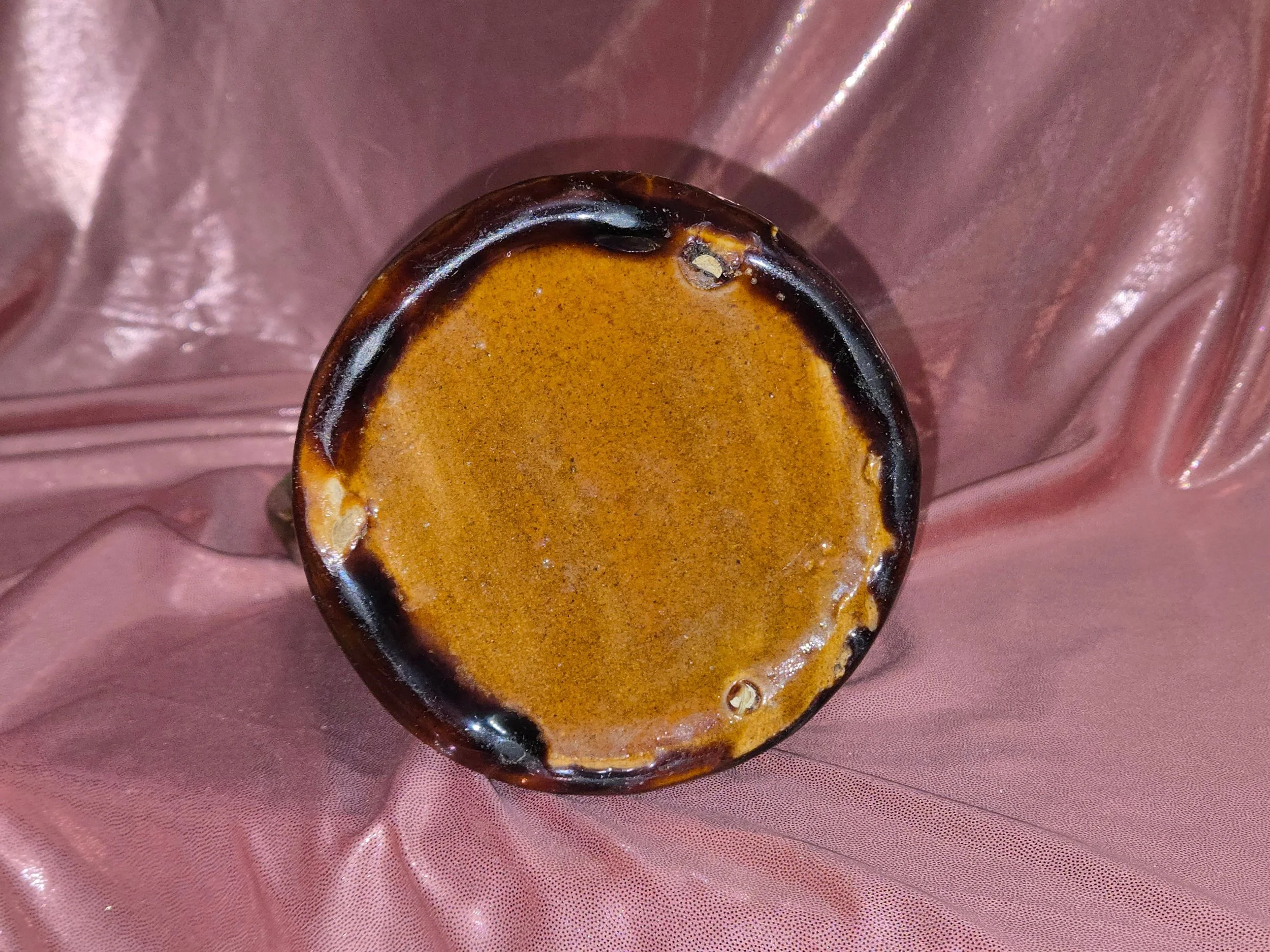 Bottom view of vintage glazed pottery pitcher