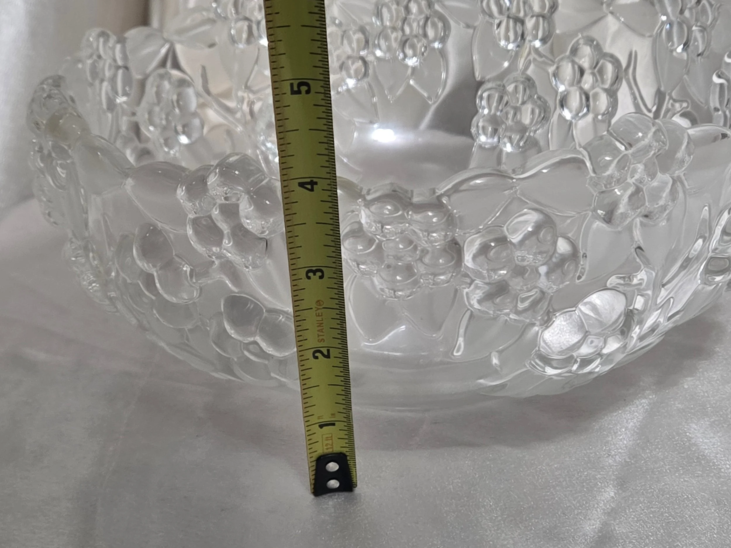 Vintage grape motif glass bowl photographed with measuring tape