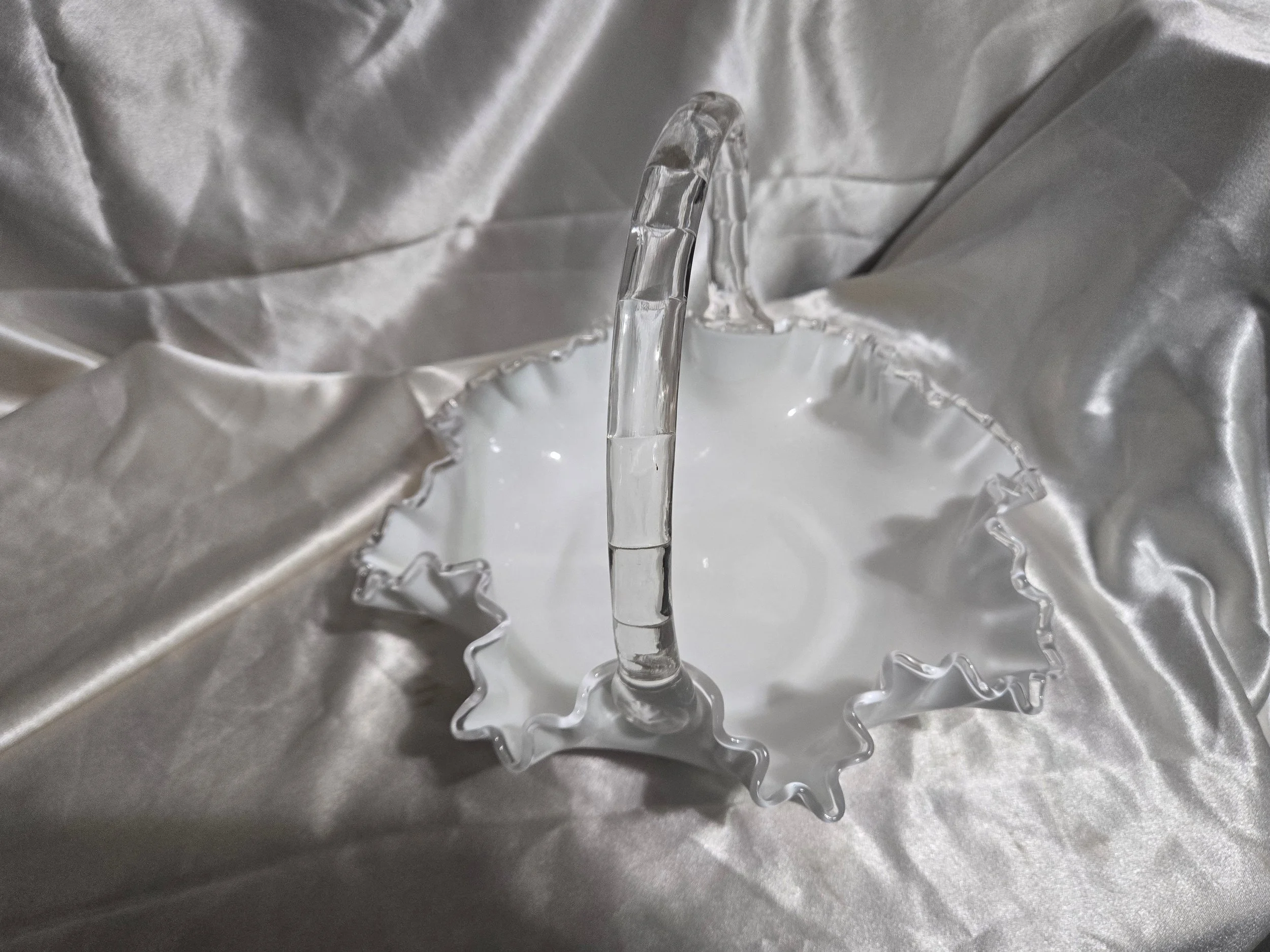 Vintage Fenton-style clear glass bowl featuring etched floral pattern and crown motif with visible handle repair.