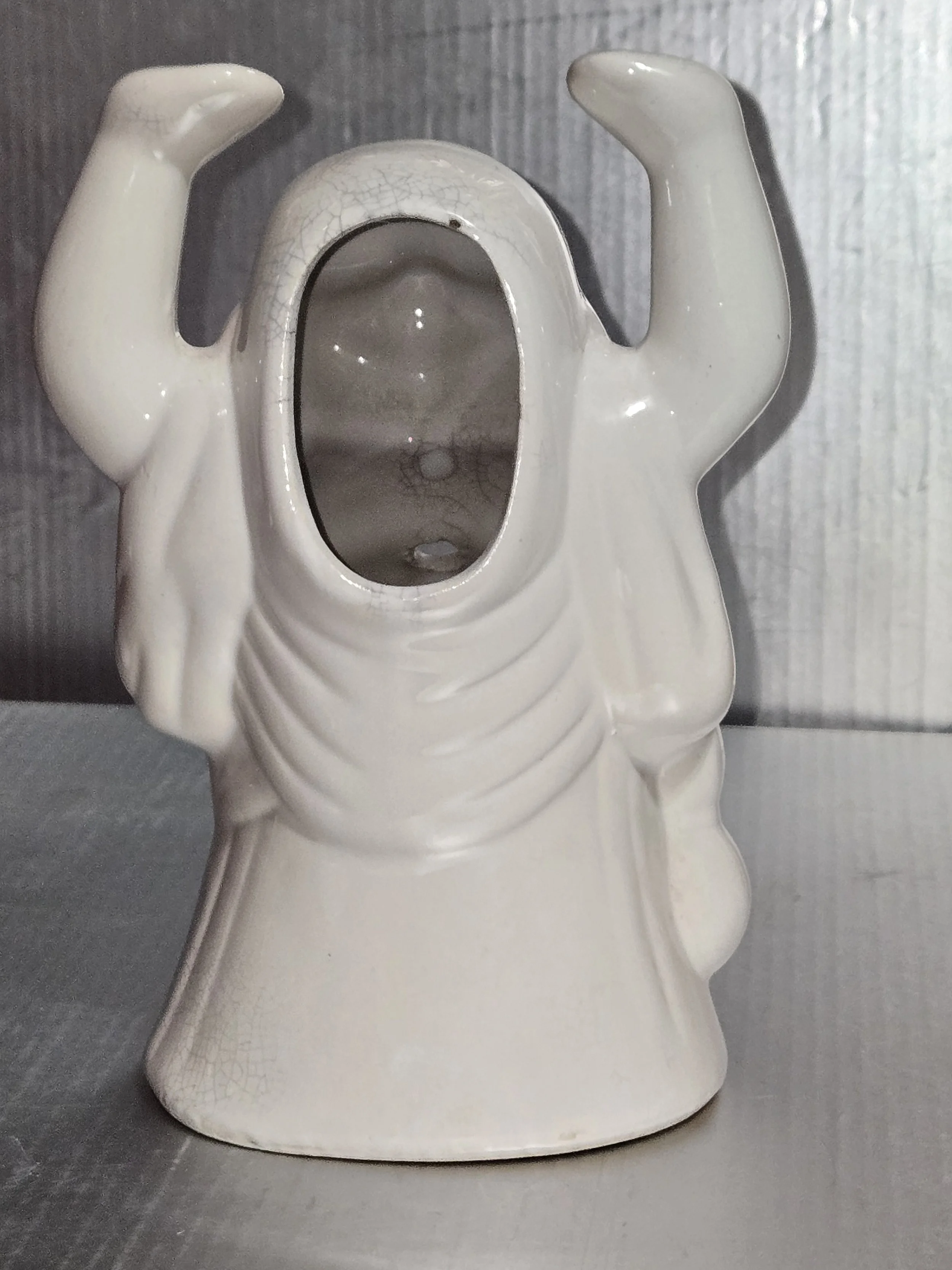 Back view of ceramic Buddha showing hollow interior