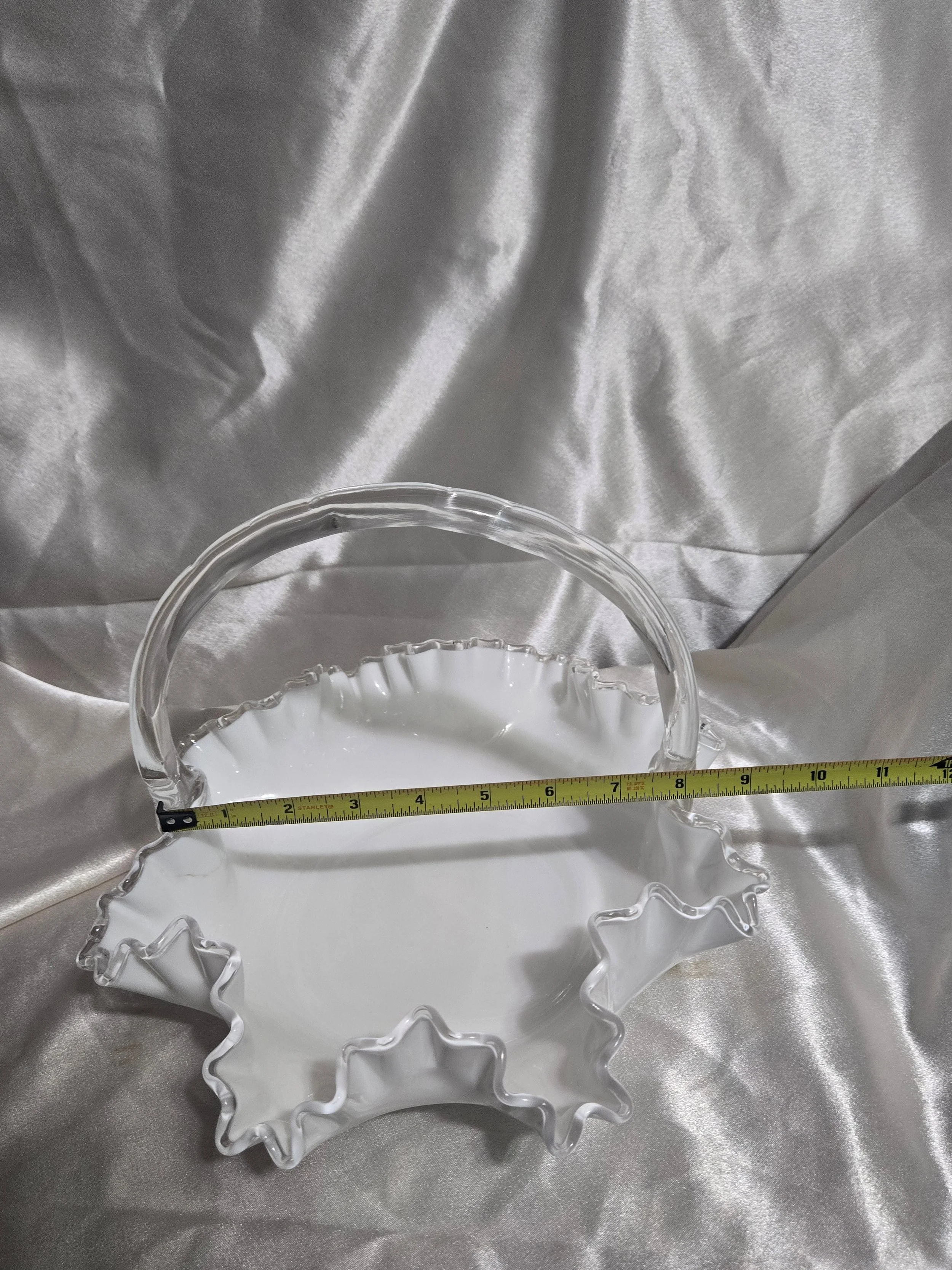 Vintage Fenton-style clear glass bowl featuring etched floral pattern and crown motif with visible handle repair.