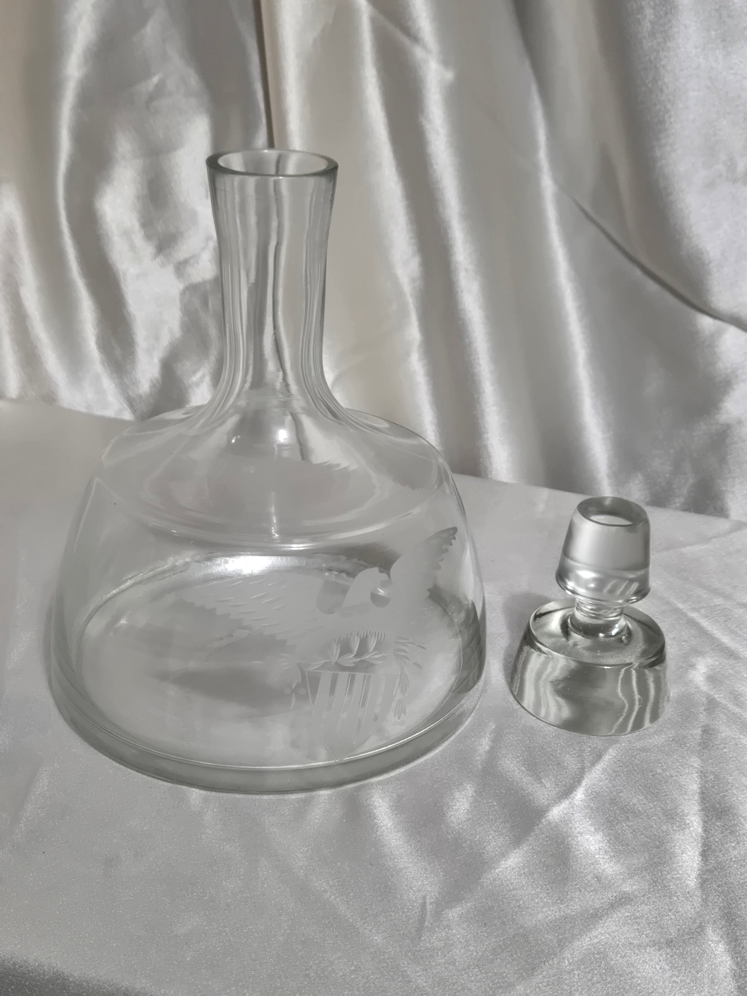 Front view of vintage etched eagle glass decanter showing detailed eagle wings and shield design