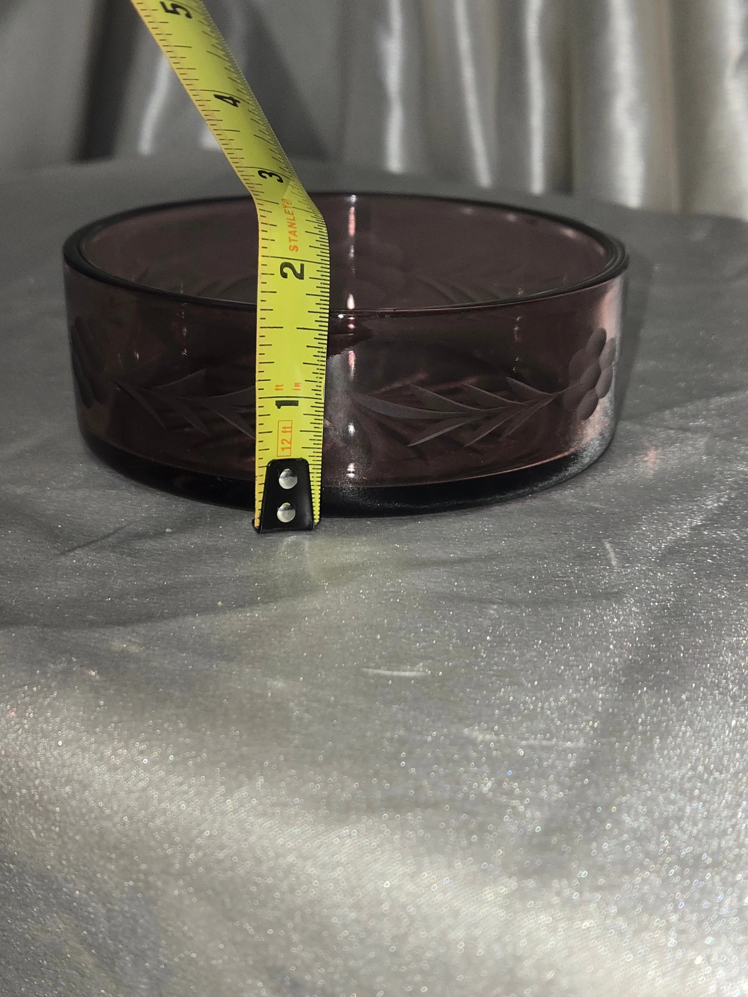 Side view of amethyst glass dish showing depth