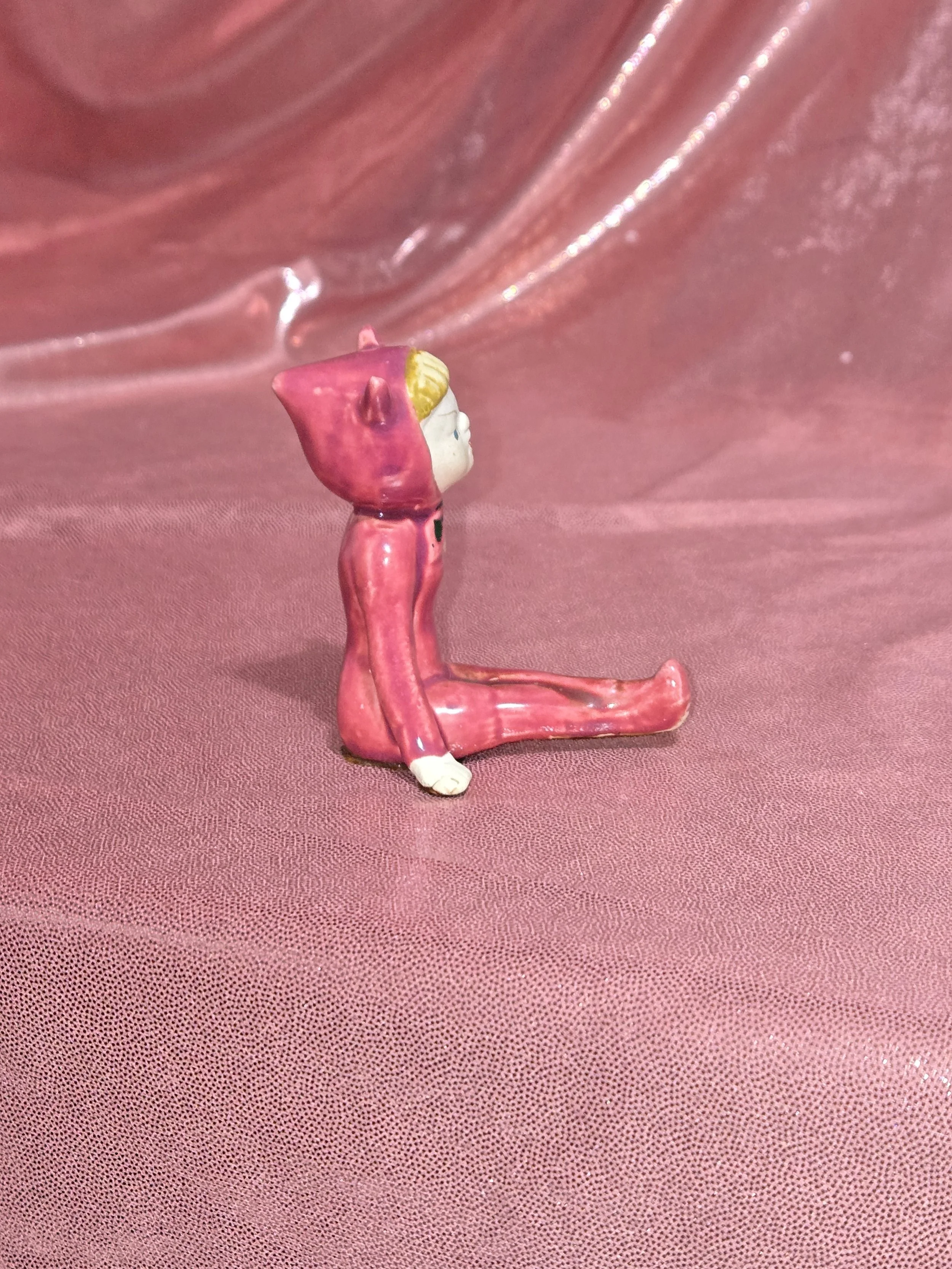 Side view of vintage devil figurines