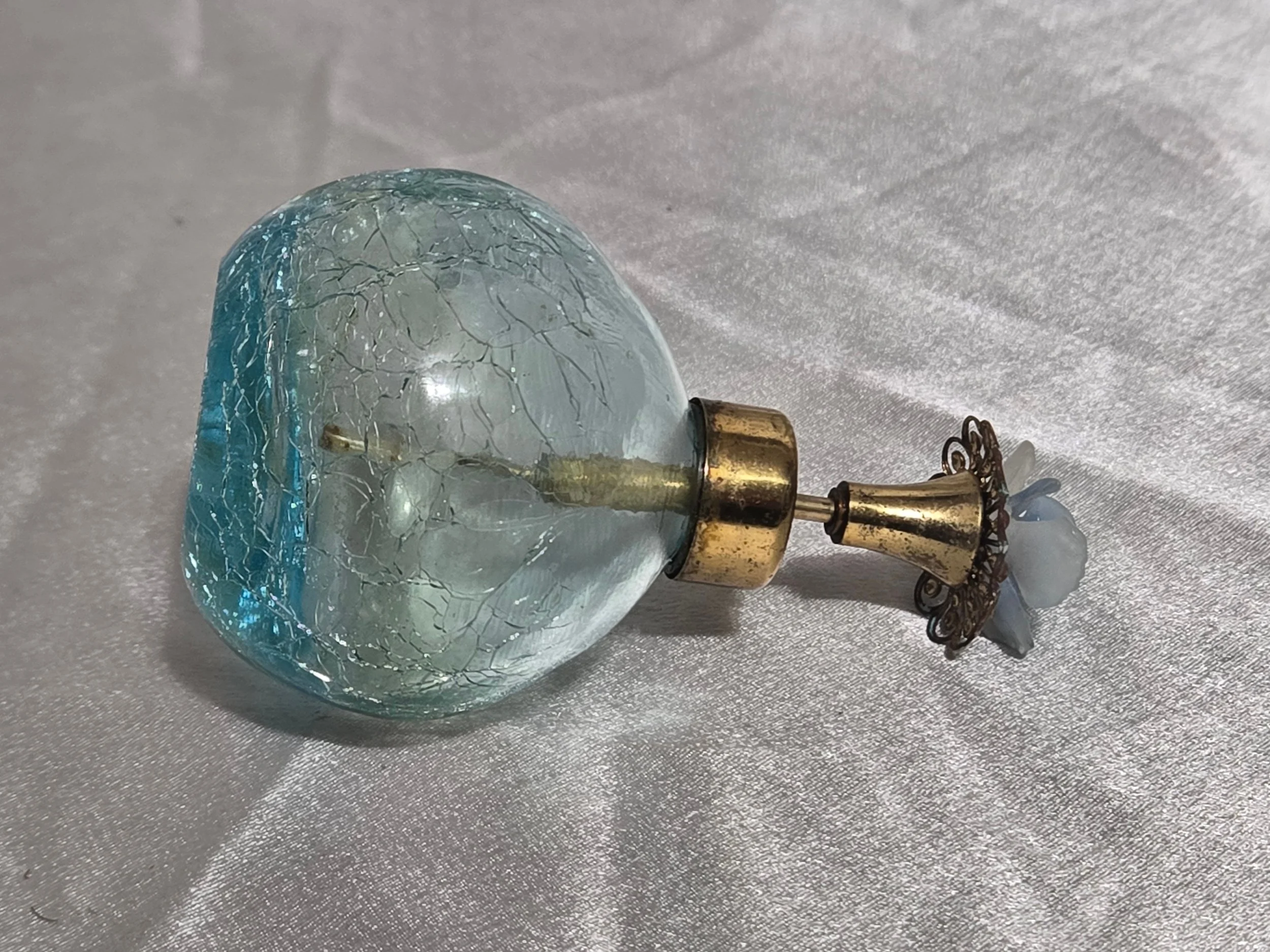 Side view vintage blue perfume bottle display