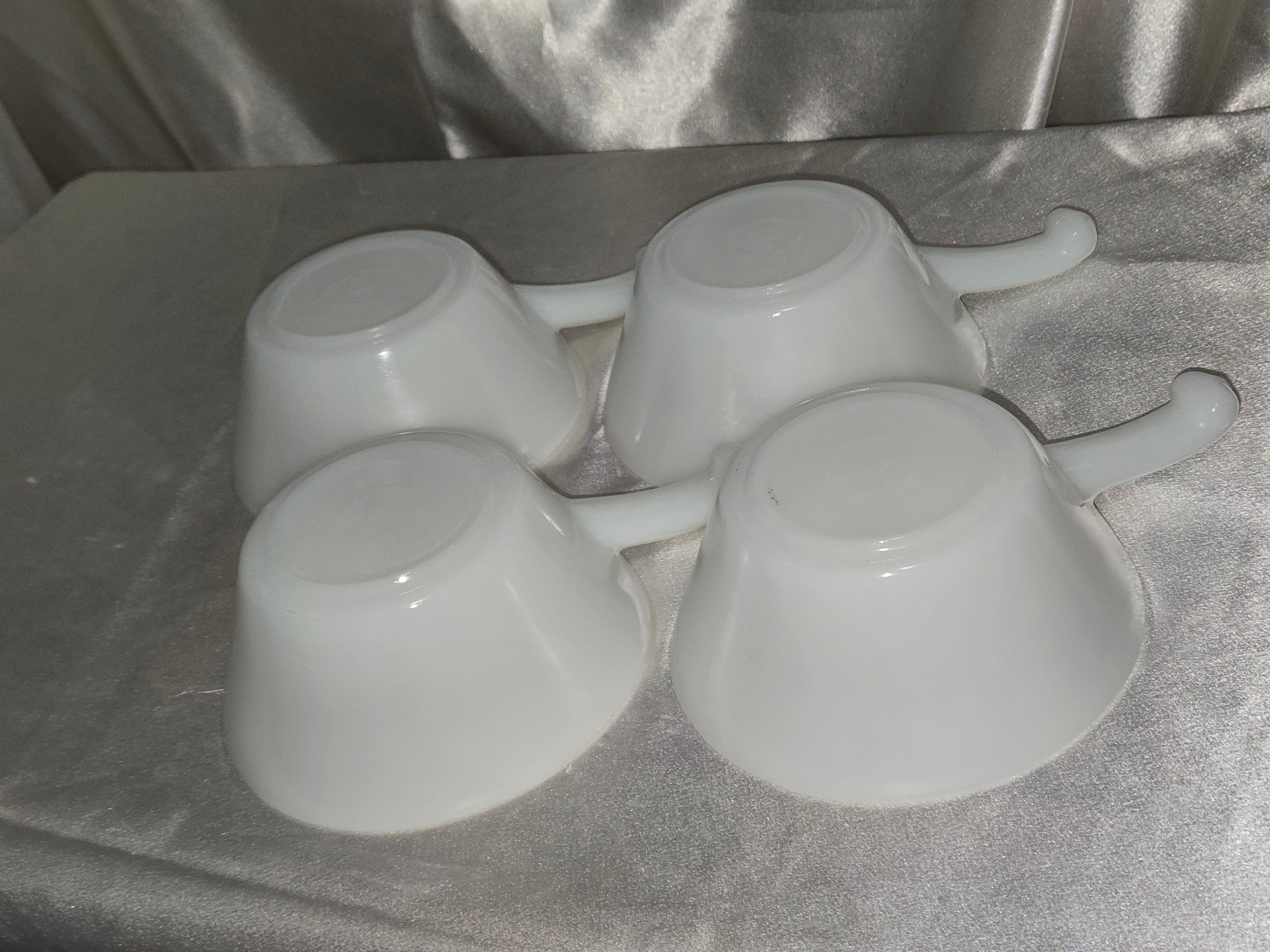Set of four matching vintage Fire-King soup bowls made of white milk glass, 1940s kitchen collectible