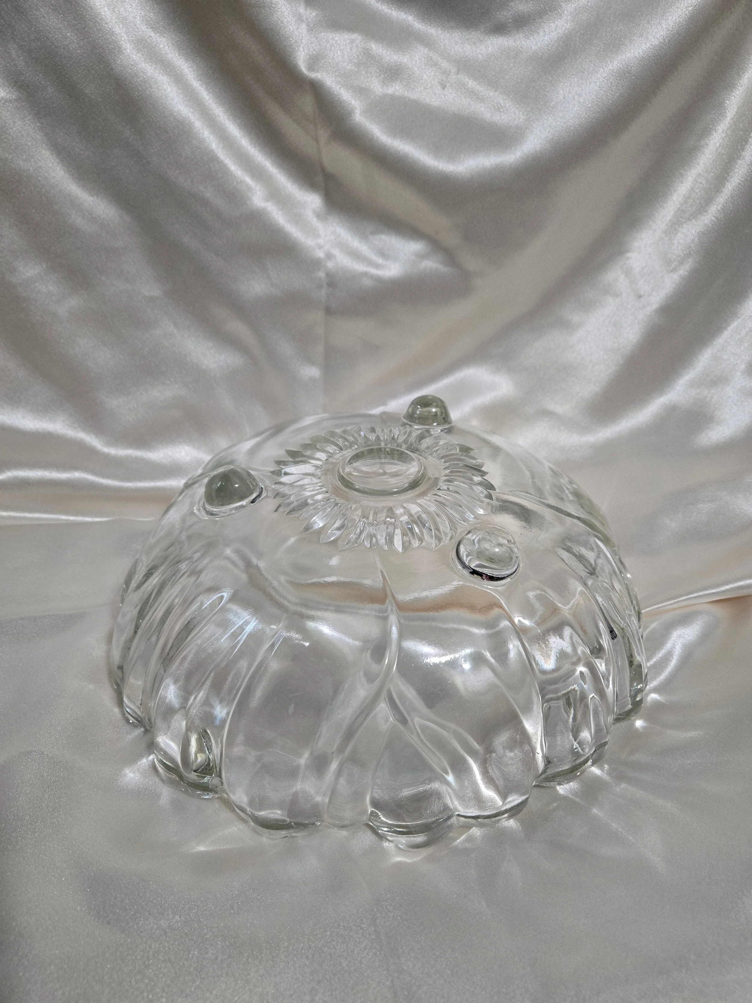 Side view showing footed base of Indiana Glass bowl