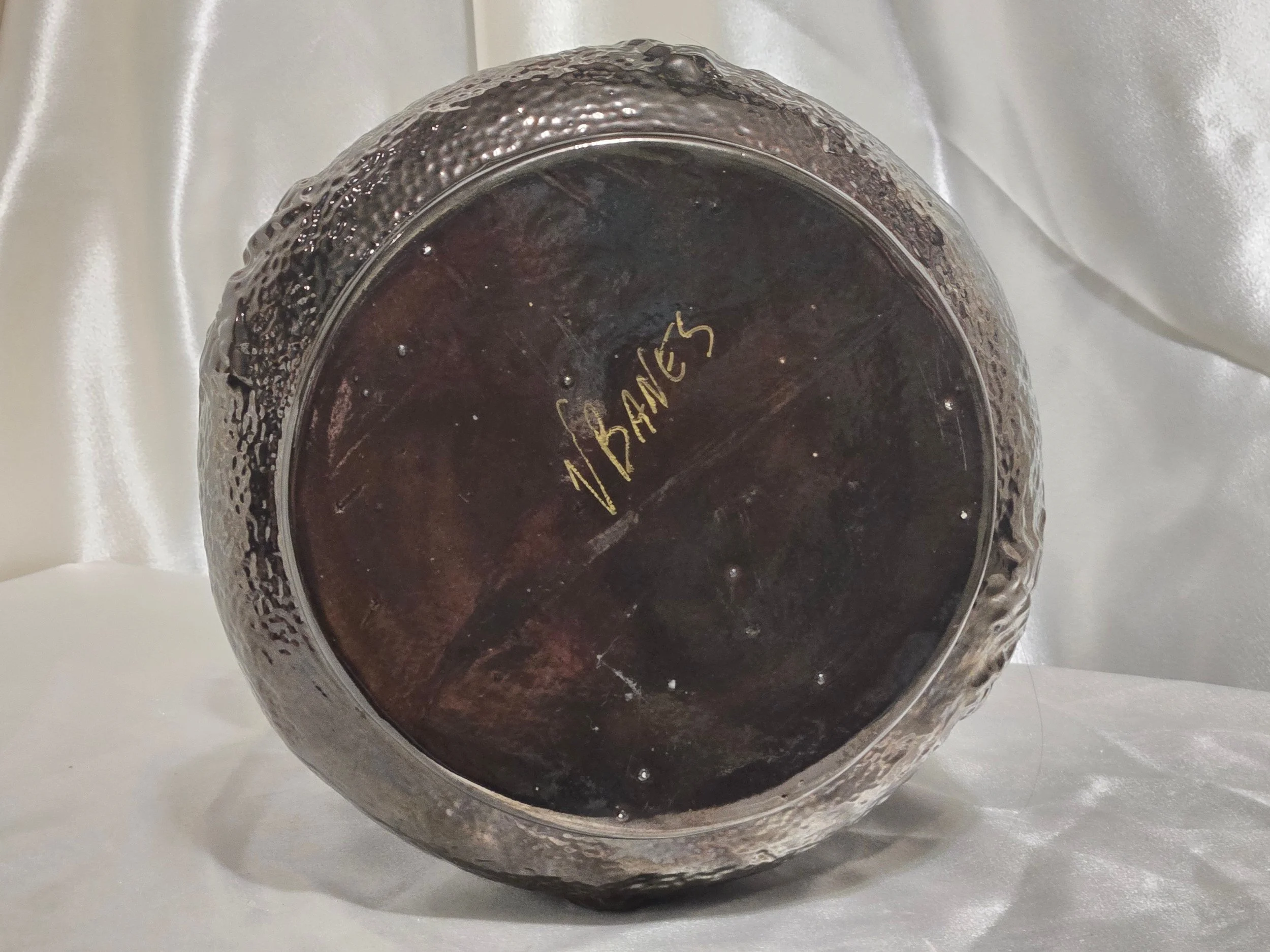 Bottom view showing V. Banes signature on pottery vase