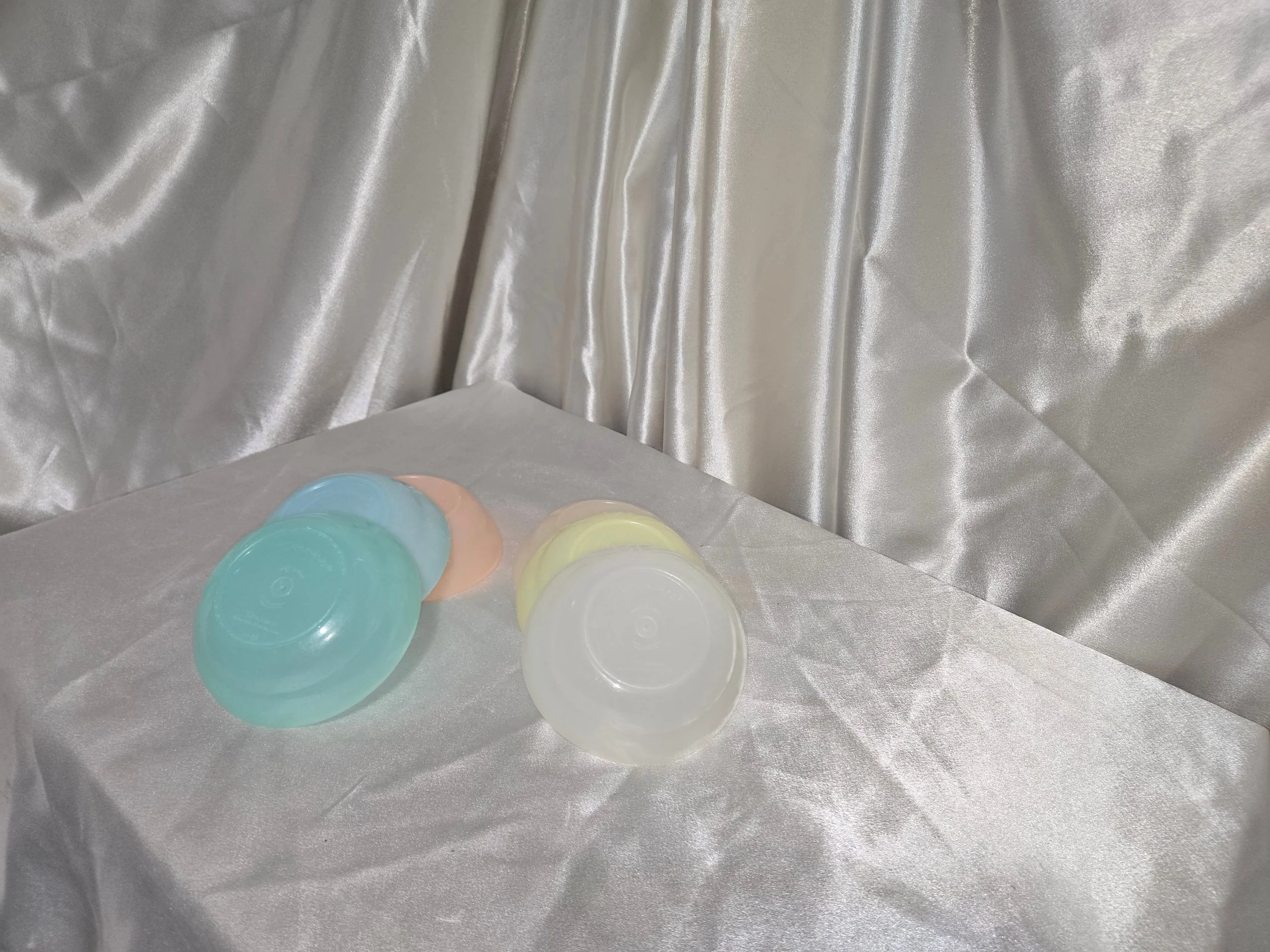 Small vintage Tupperware bowls in assorted pastel colors