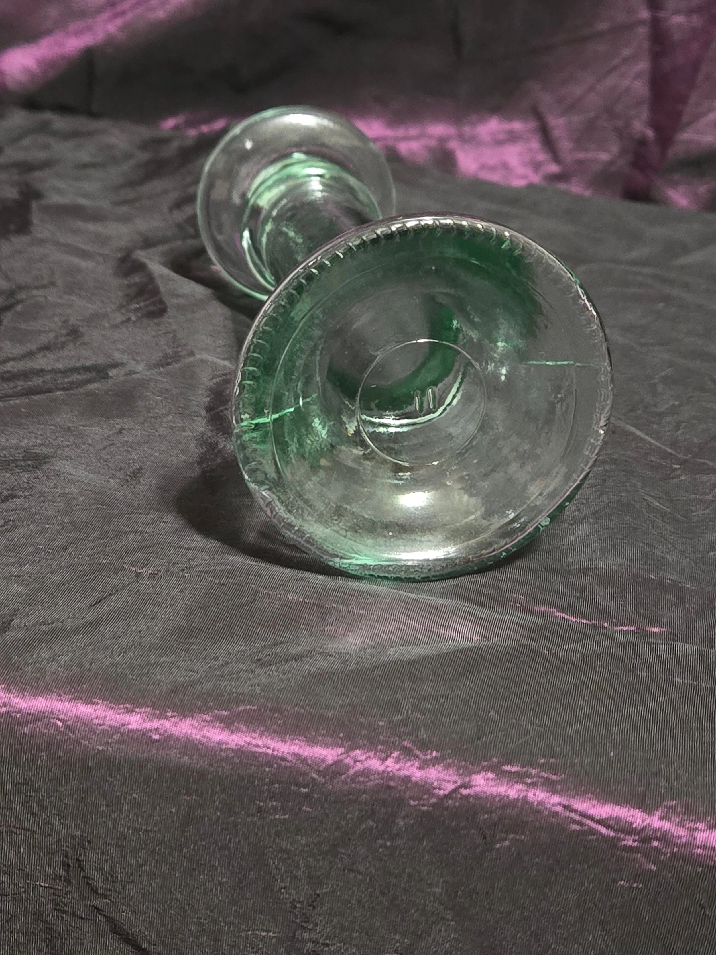 Clear glass candlestick holder with faint green tint, elegant fluted base, and timeless vintage style.