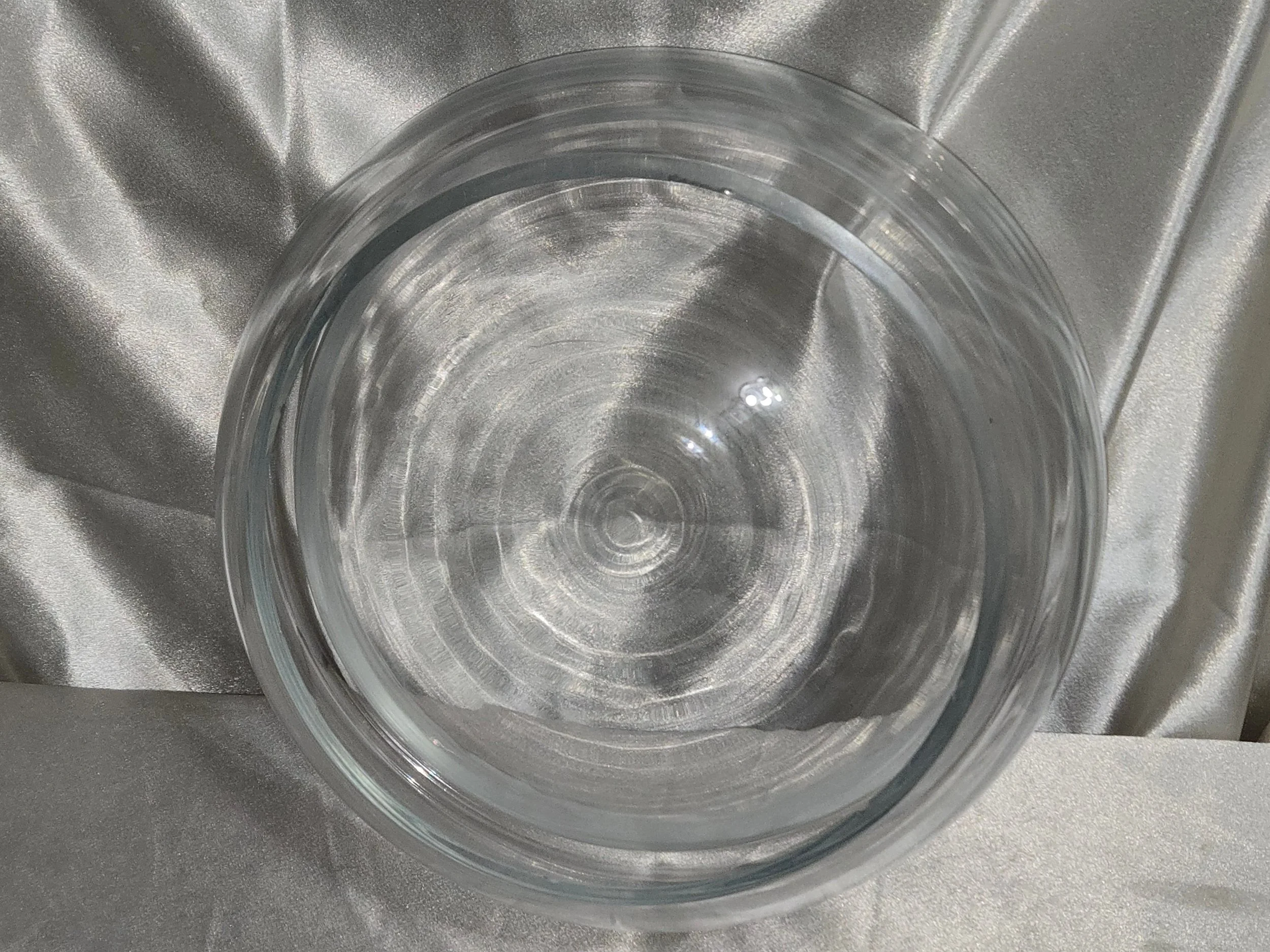 Bottom view of double wall clear glass bowl showing rounded base