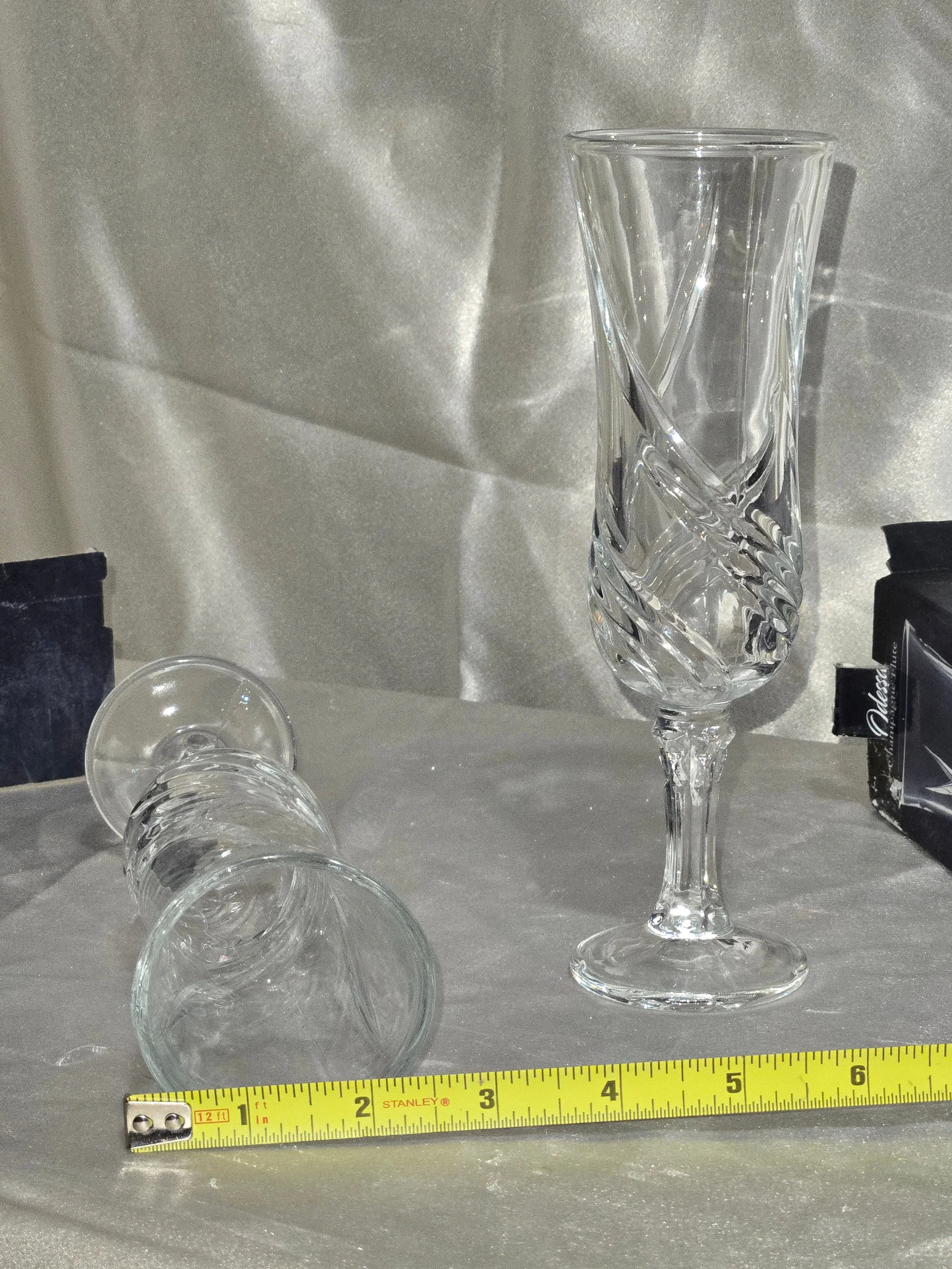 Tall clear champagne flute with elegant swirl cut pattern