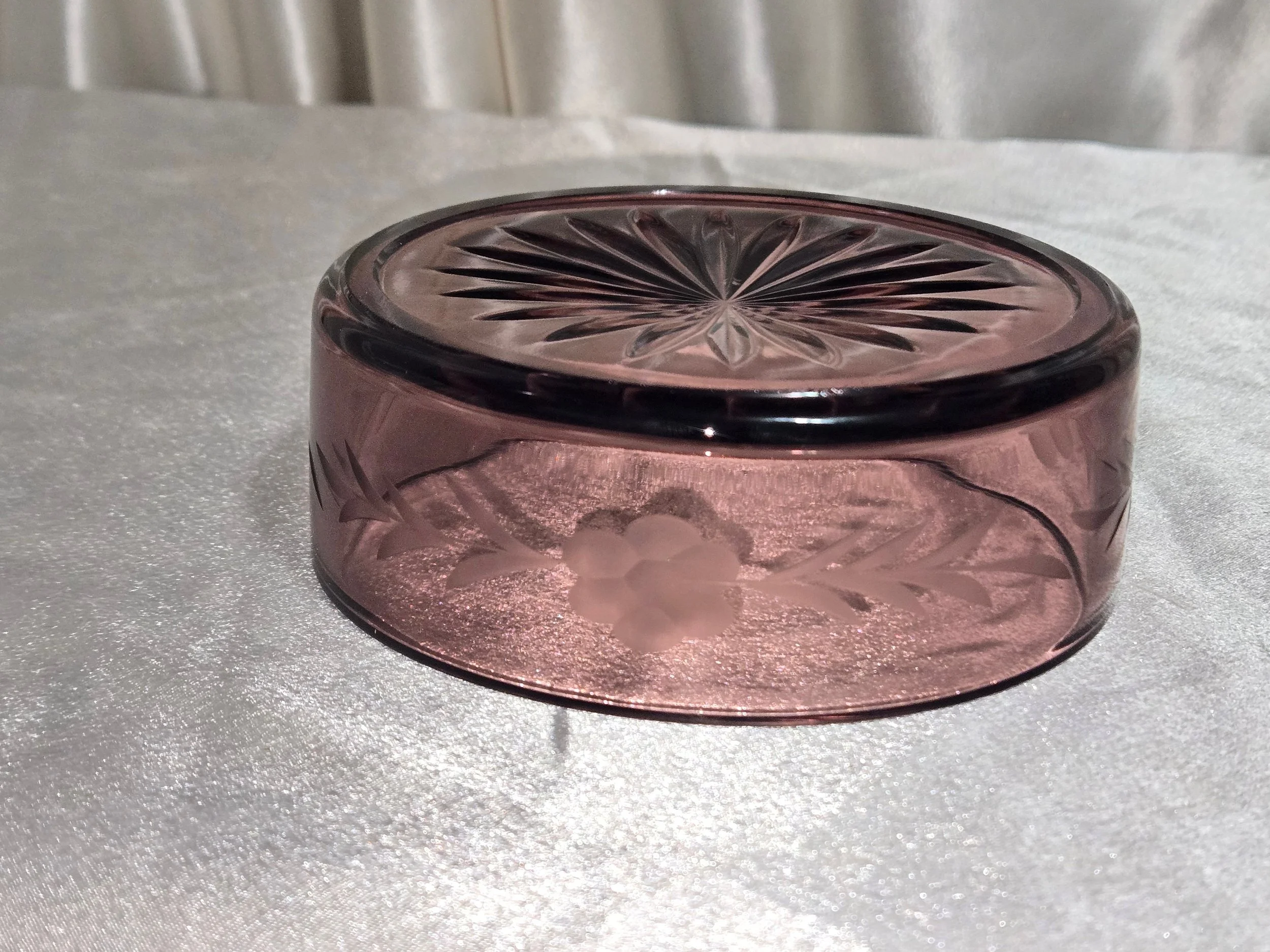 Purple glass bowl with starburst design