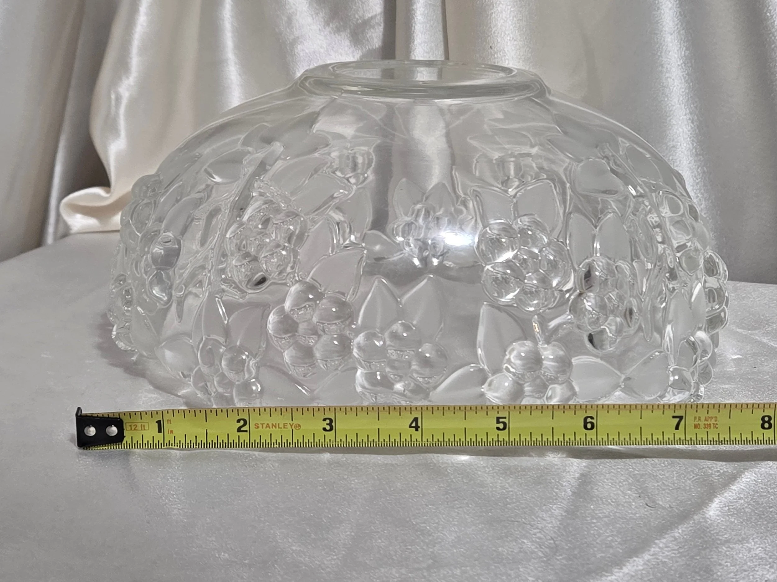 Vintage grape motif glass bowl photographed with measuring tape