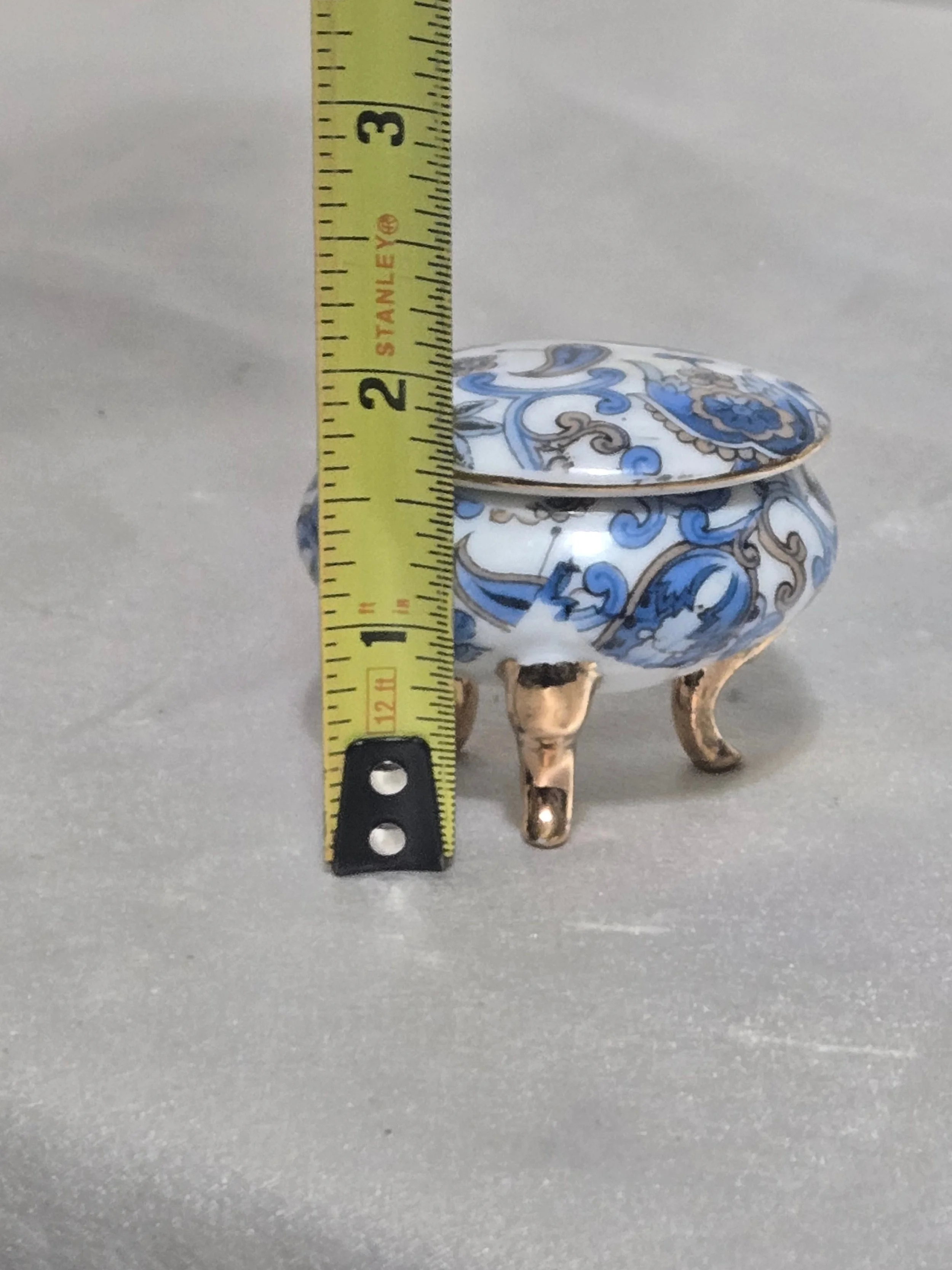 Blue floral lidded trinket box close up