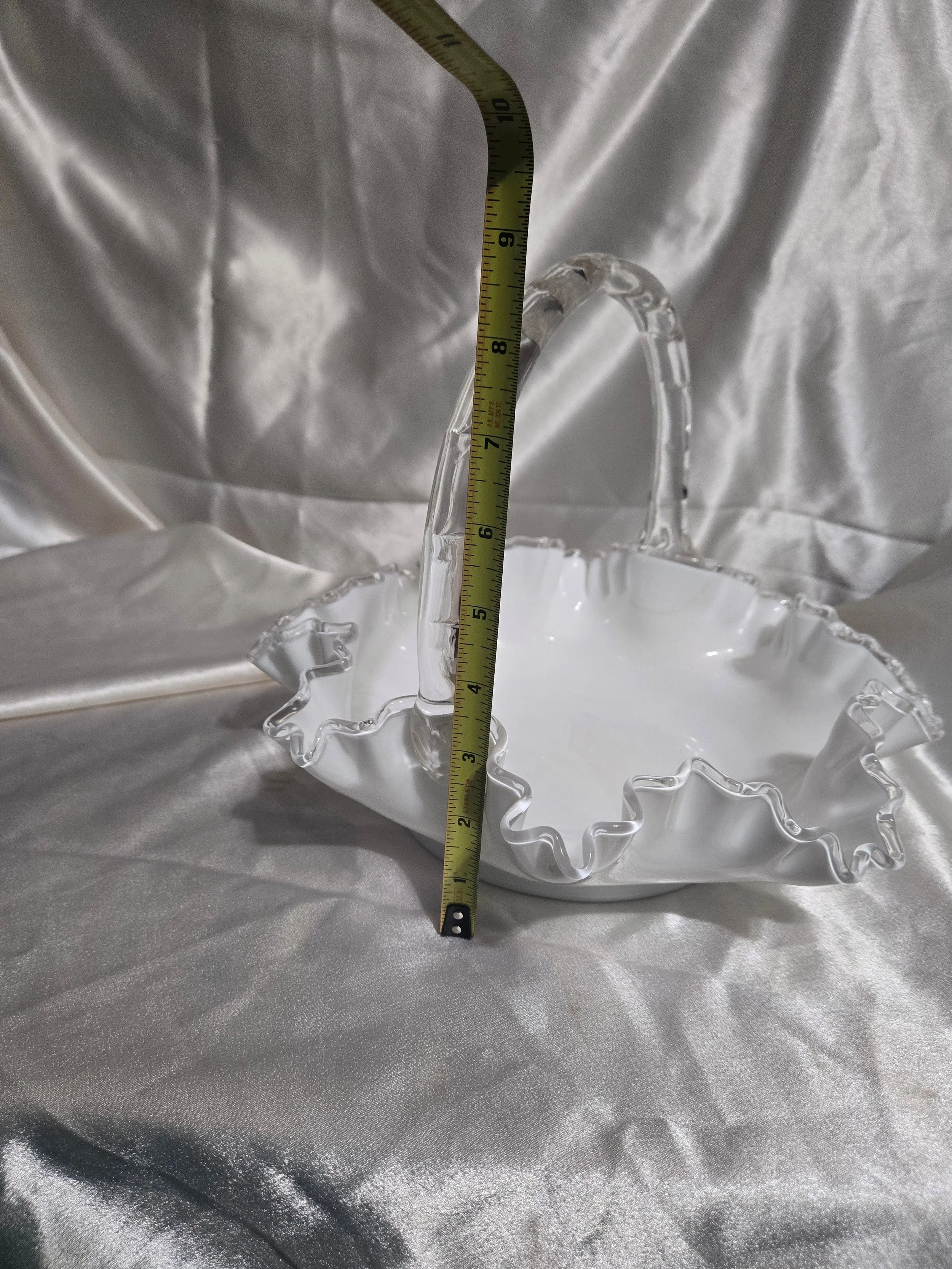 Vintage Fenton-style clear glass bowl featuring etched floral pattern and crown motif with visible handle repair.