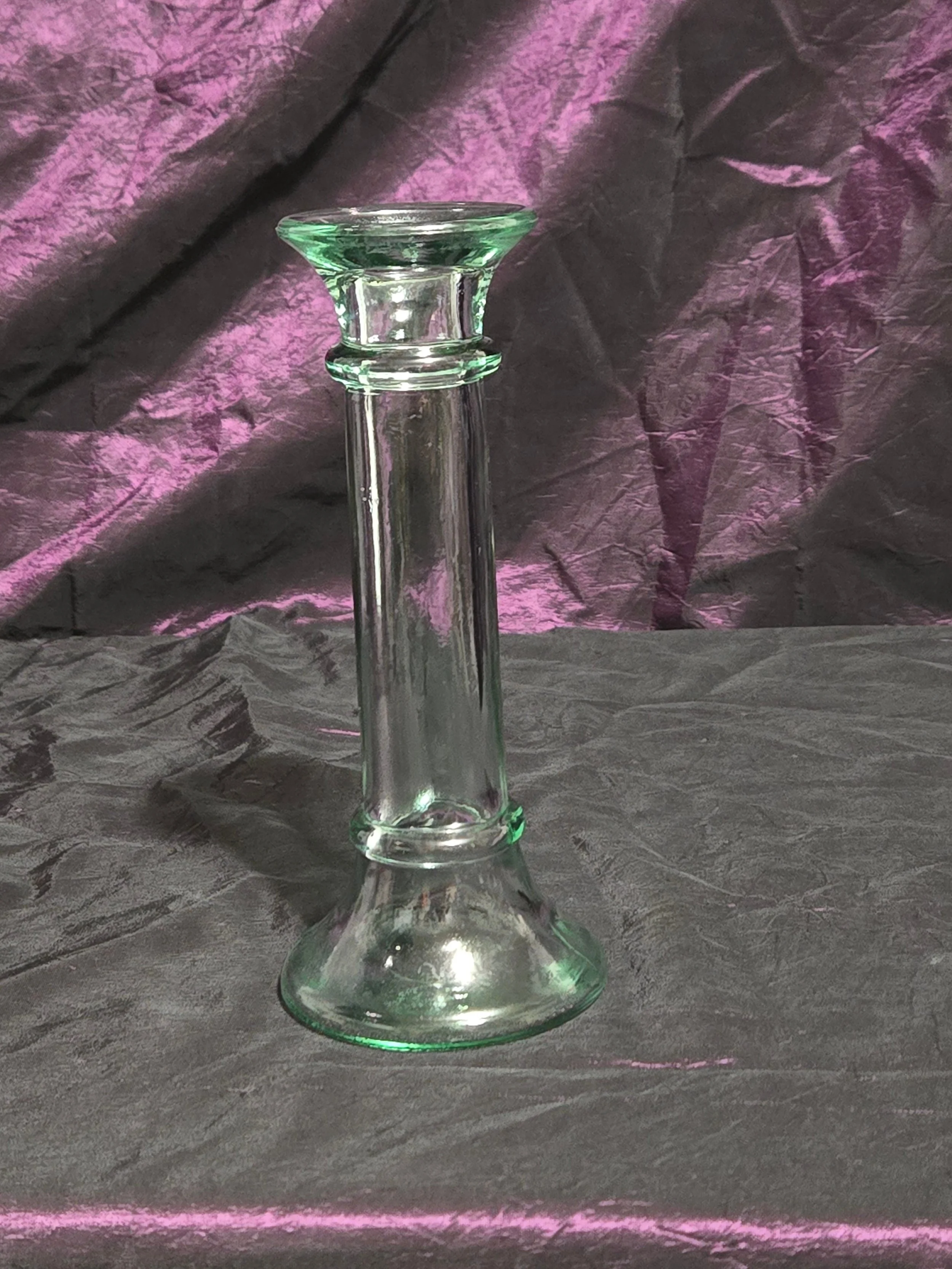 Clear glass candlestick holder with faint green tint, elegant fluted base, and timeless vintage style.