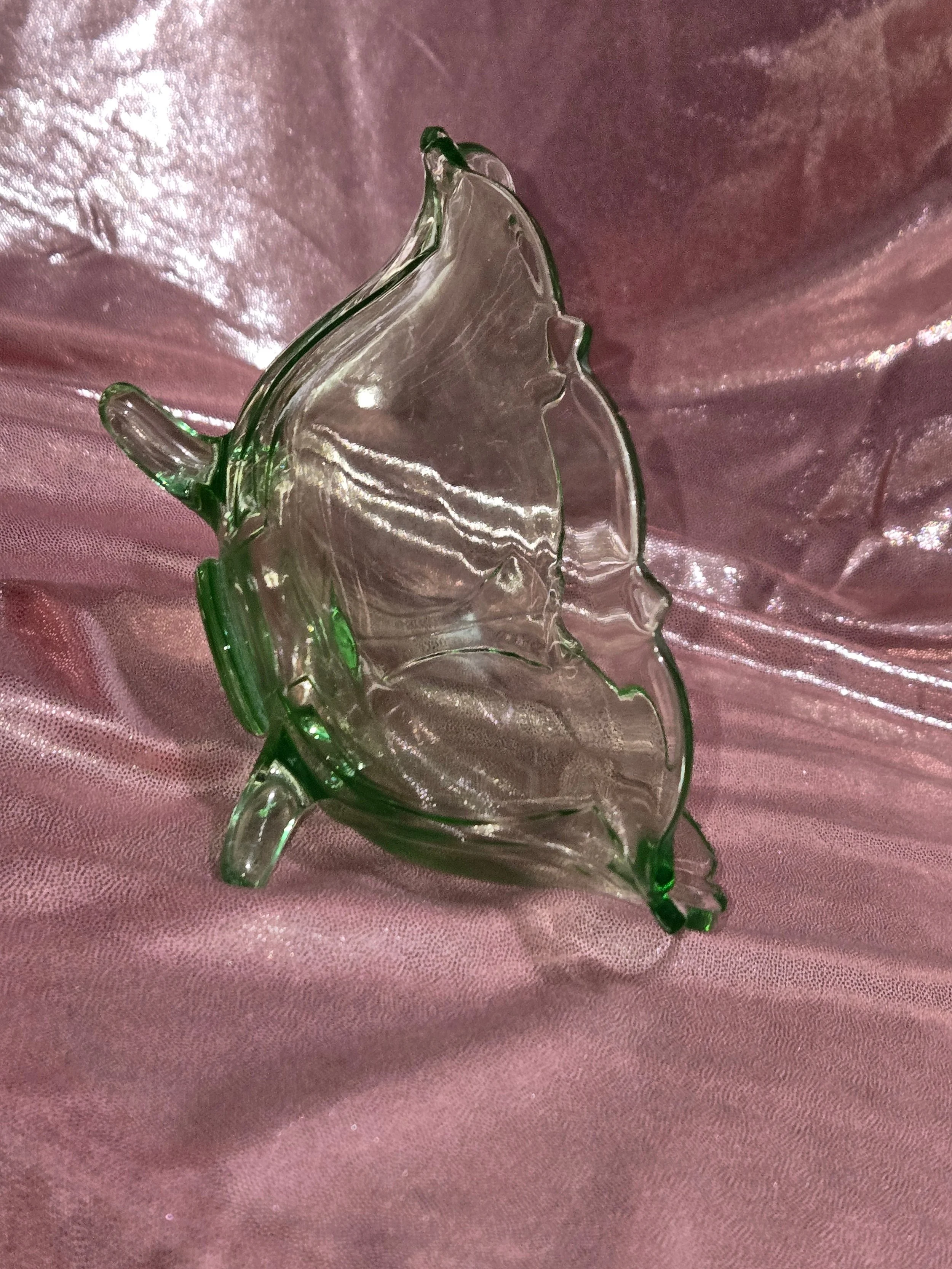 Side view of green uranium glass bowl showing scalloped rim