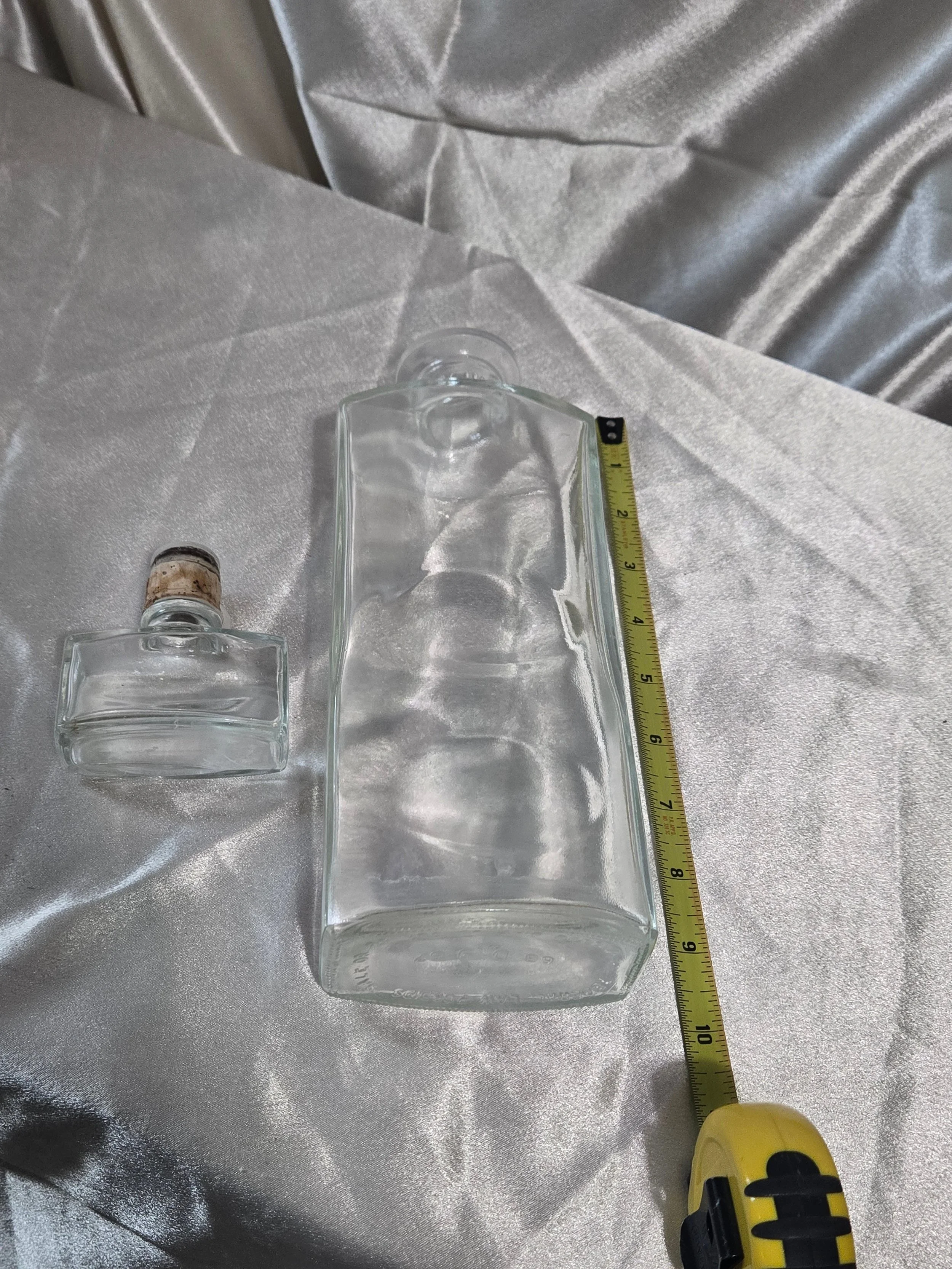 IW Harper Kentucky Bourbon decanter standing upright on silver backdrop