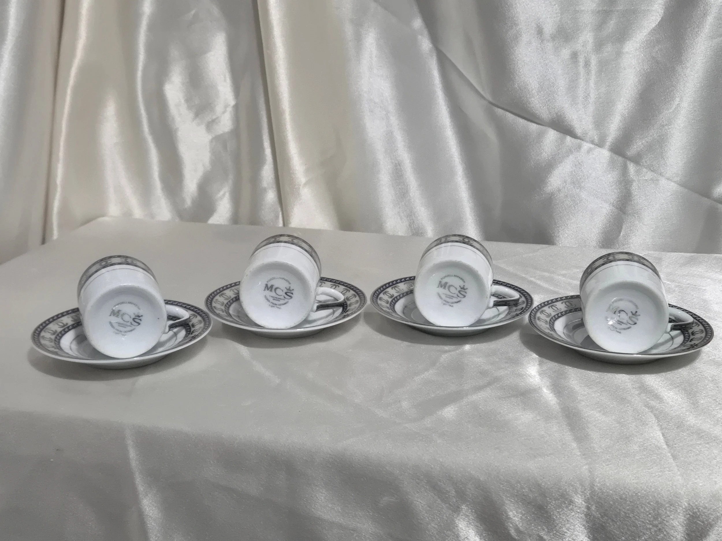 Set of 4 Mc Bavaria Espresso Demitasse Cups and Saucers with cups laid to show the bottom of cup