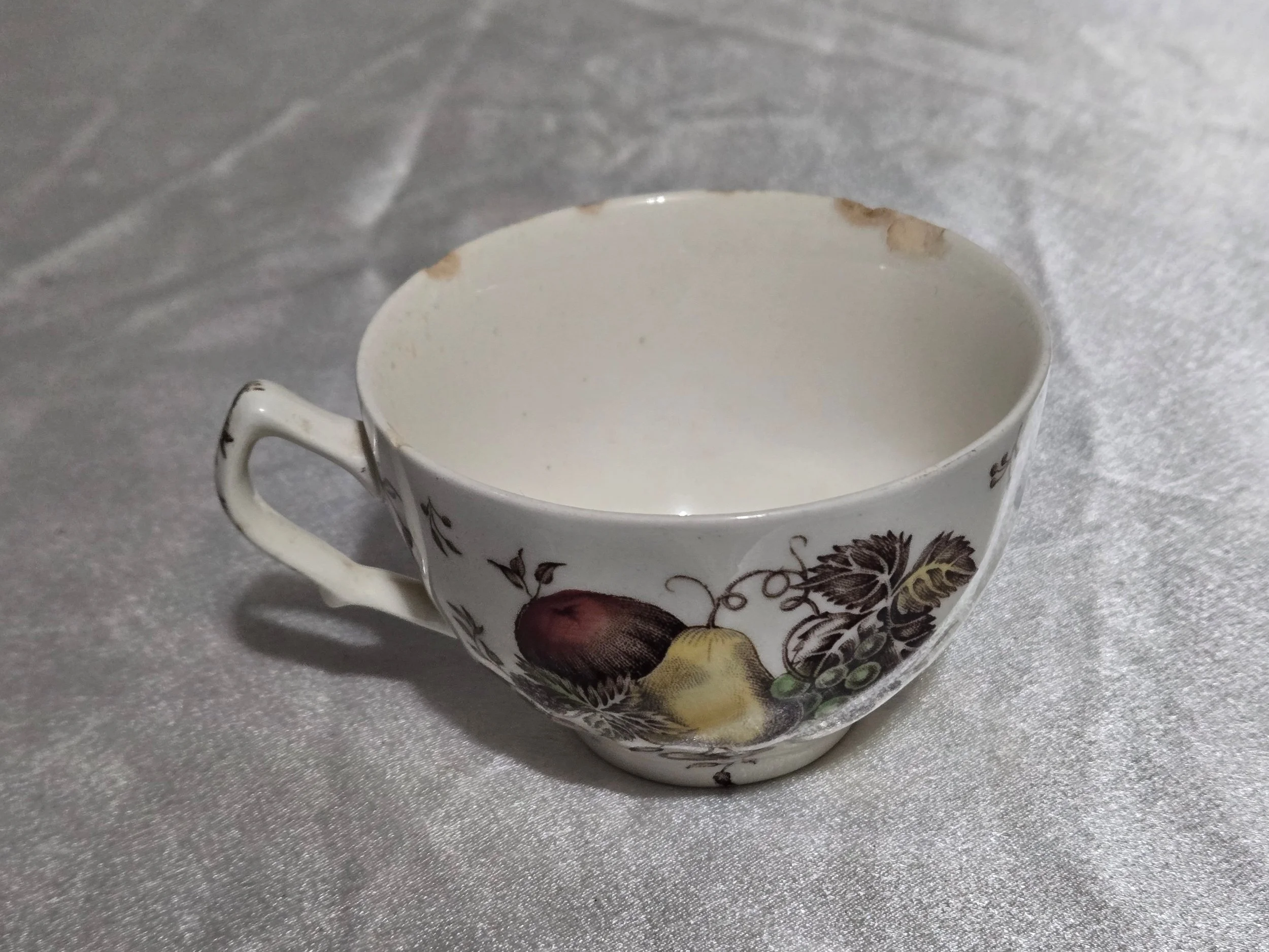 Vintage Autumn’s Delight floral dish with warm orange and gold tones, embossed leaf pattern, and scalloped edges on display.