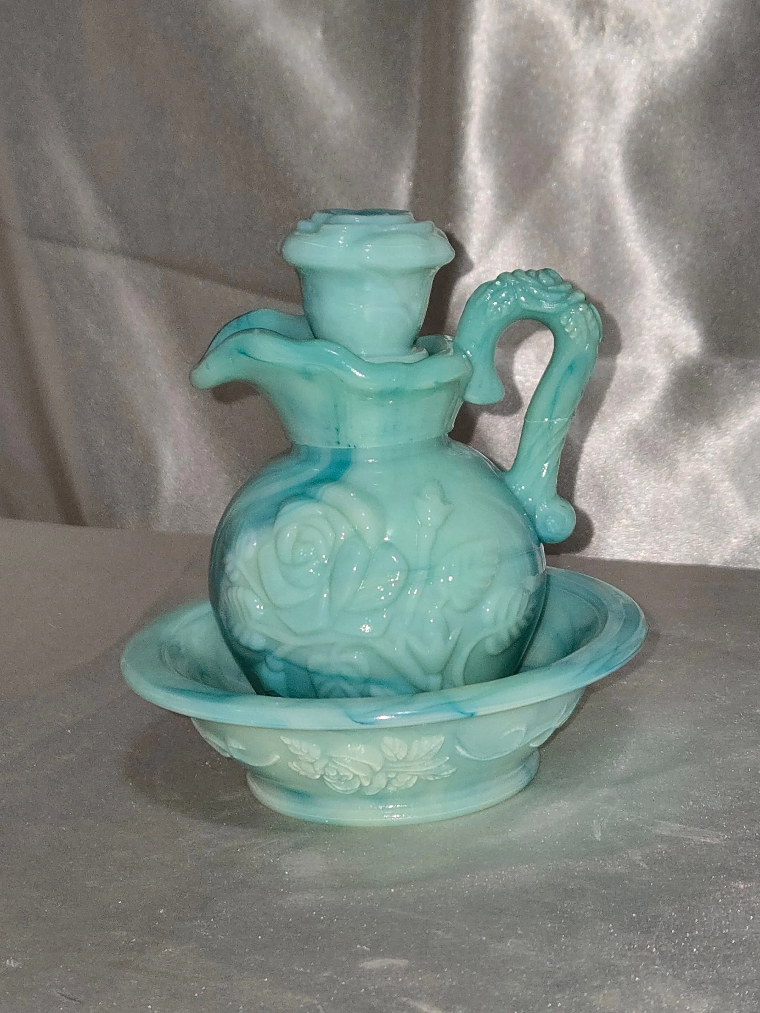 Vintage Avon jadeite style milk glass pitcher and bowl set from the 1970s displayed on a neutral background