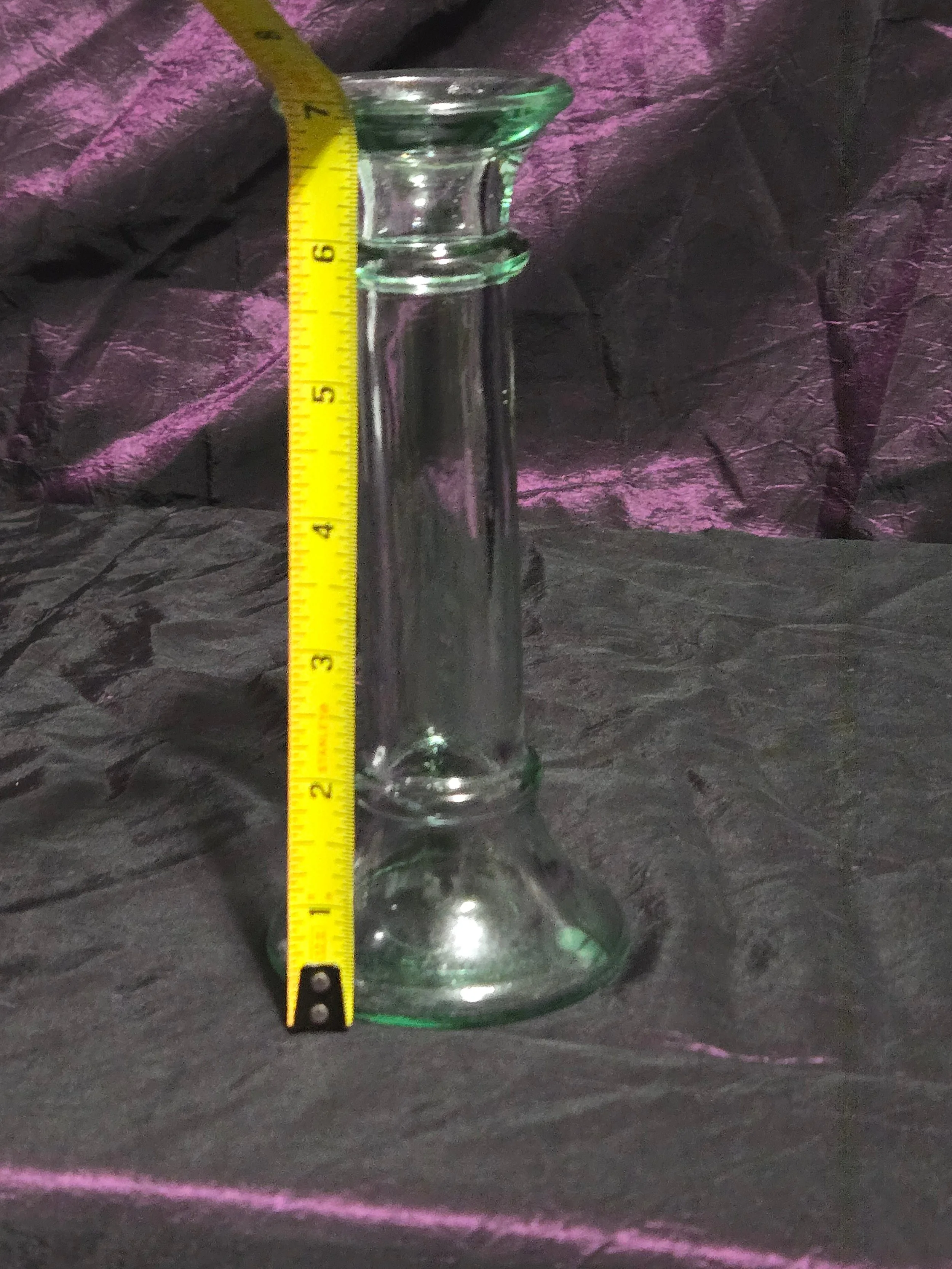 Clear glass candlestick holder with faint green tint, elegant fluted base, and timeless vintage style.